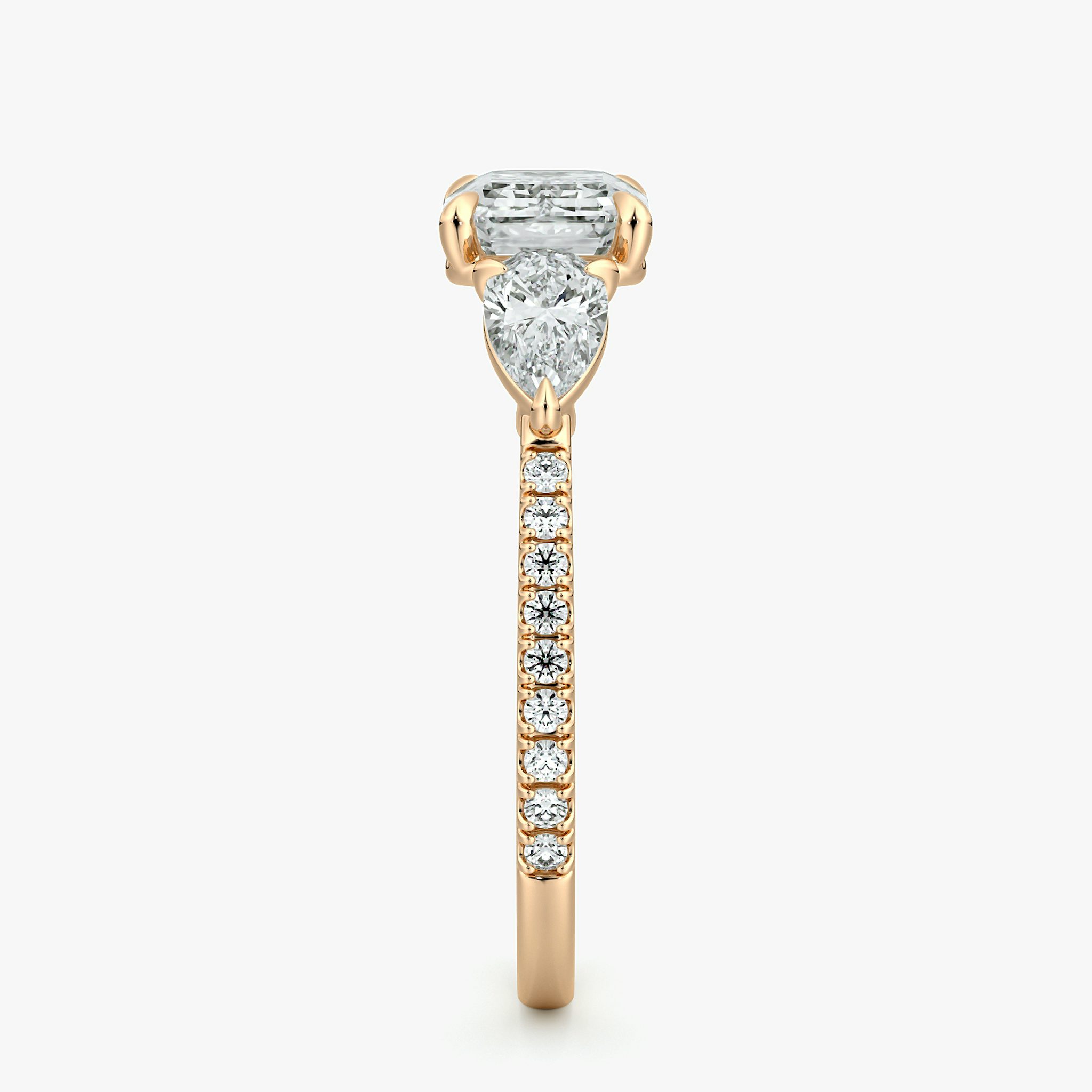 The Three Stone | Emerald | 14k | Rose Gold | bandAccent: Pavé | diamondOrientation: horizontal | sideStoneCarat: 0.25ct | sideStoneShape: Pear | caratWeight: other