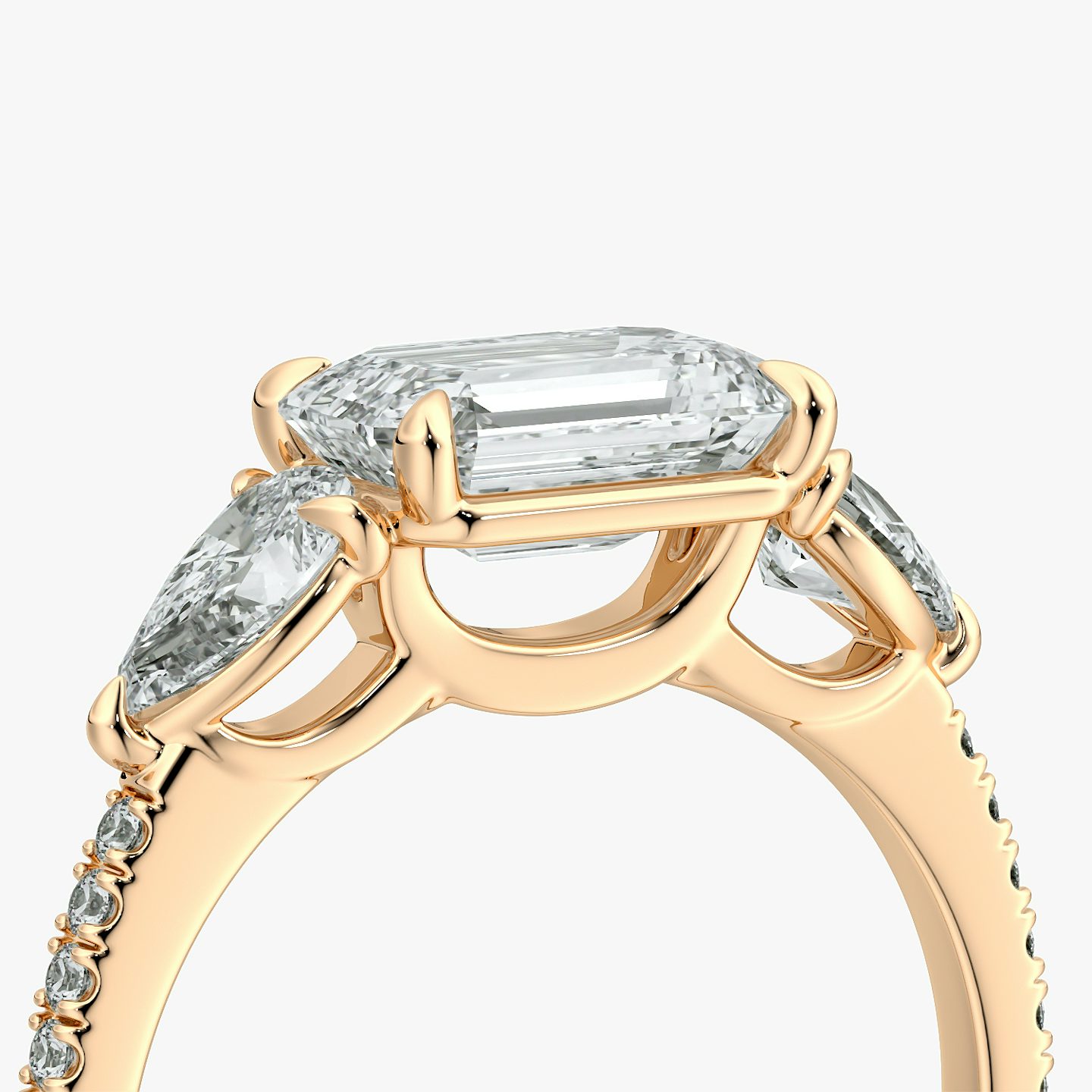 The Three Stone | Emerald | 14k | Rose Gold | bandAccent: Pavé | diamondOrientation: horizontal | sideStoneCarat: 0.25ct | sideStoneShape: Pear | caratWeight: other