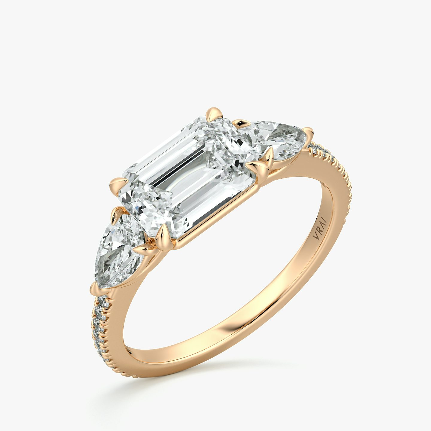 The Three Stone | Emerald | 14k | Rose Gold | bandAccent: Pavé | diamondOrientation: horizontal | sideStoneCarat: 0.25ct | sideStoneShape: Pear | caratWeight: other