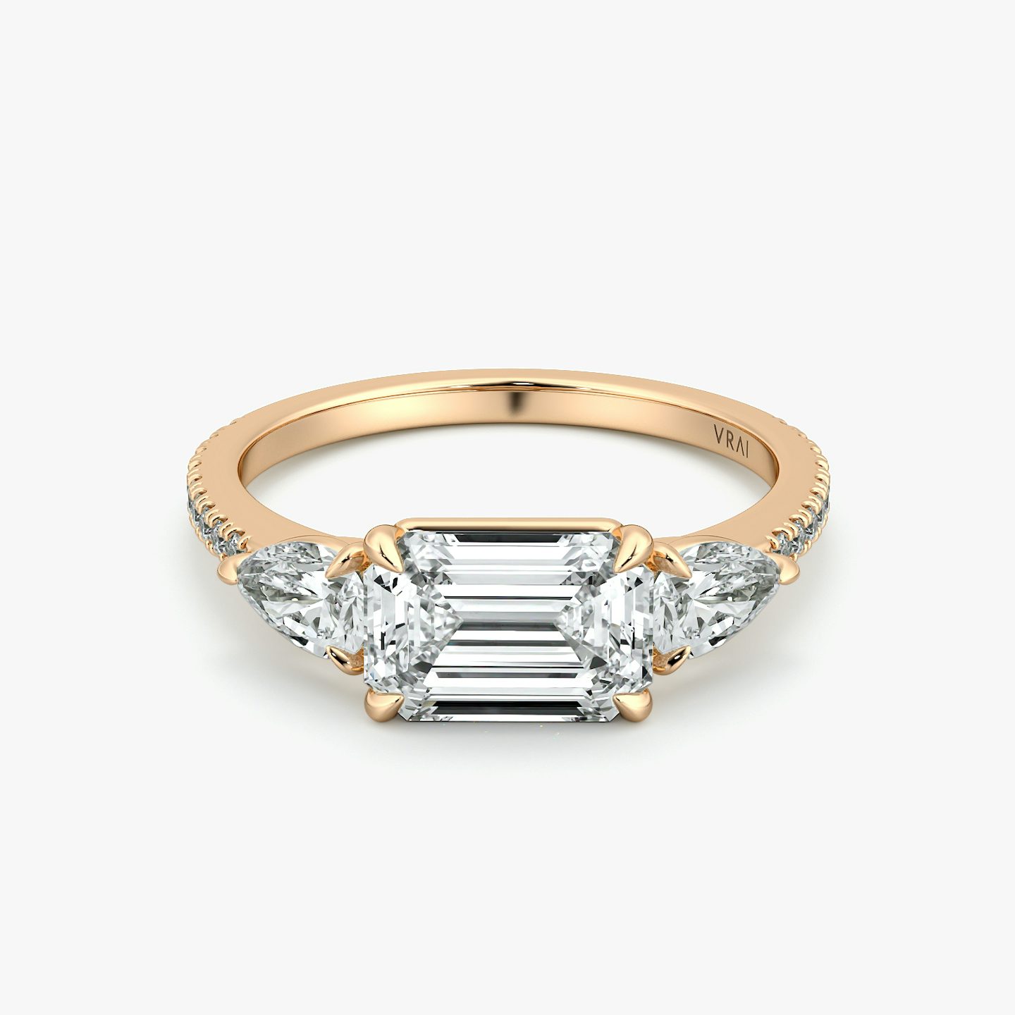 The Three Stone | Emerald | 14k | Rose Gold | bandAccent: Pavé | diamondOrientation: horizontal | sideStoneCarat: 0.25ct | sideStoneShape: Pear | caratWeight: other