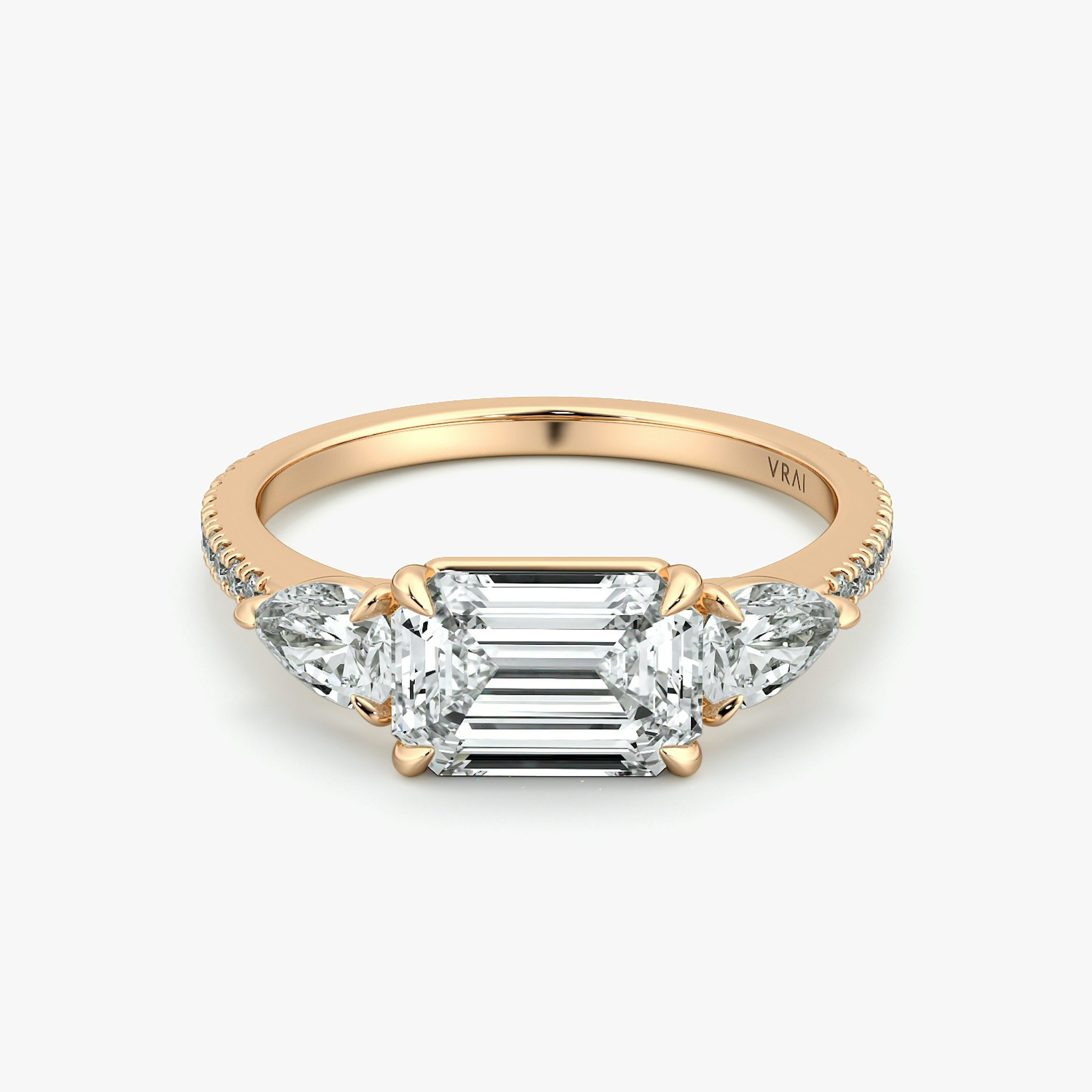 The Three Stone | Emerald | 14k | Rose Gold | bandAccent: Pavé | diamondOrientation: horizontal | sideStoneCarat: 0.25ct | sideStoneShape: Pear | caratWeight: other