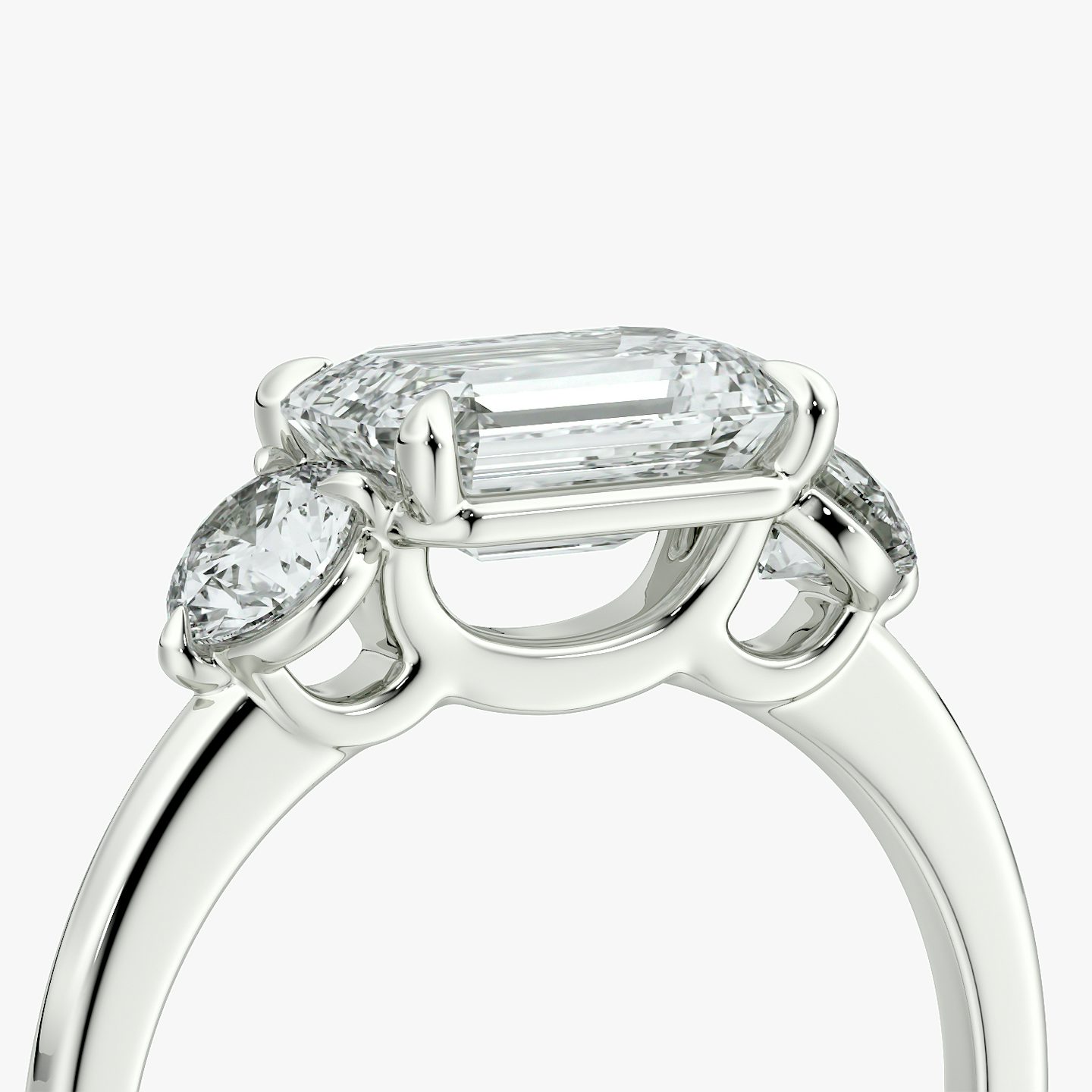 The Three Stone | Emerald | 18k | White Gold | bandAccent: Plain | diamondOrientation: horizontal | sideStoneCarat: 0.25ct | sideStoneShape: Round Brilliant | caratWeight: other