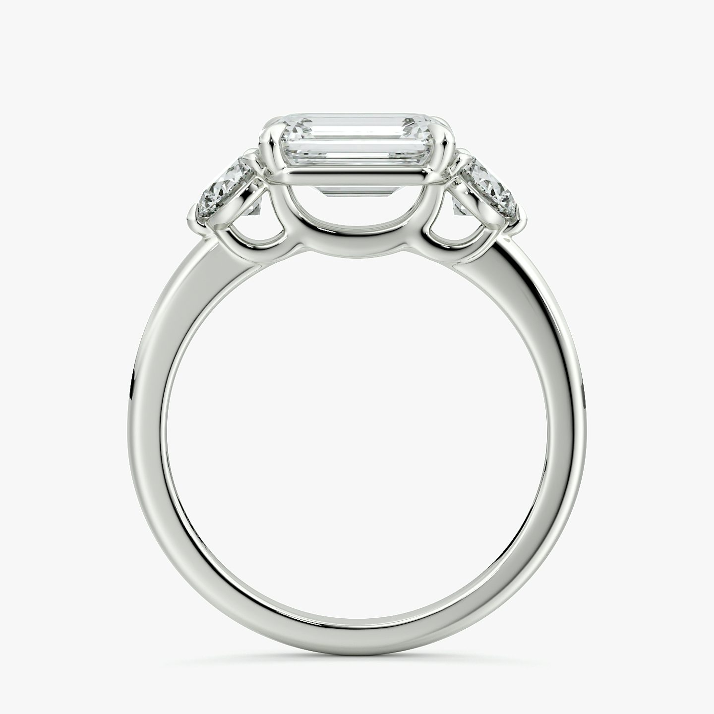 The Three Stone | Emerald | 18k | White Gold | bandAccent: Plain | diamondOrientation: horizontal | sideStoneCarat: 0.25ct | sideStoneShape: Round Brilliant | caratWeight: other