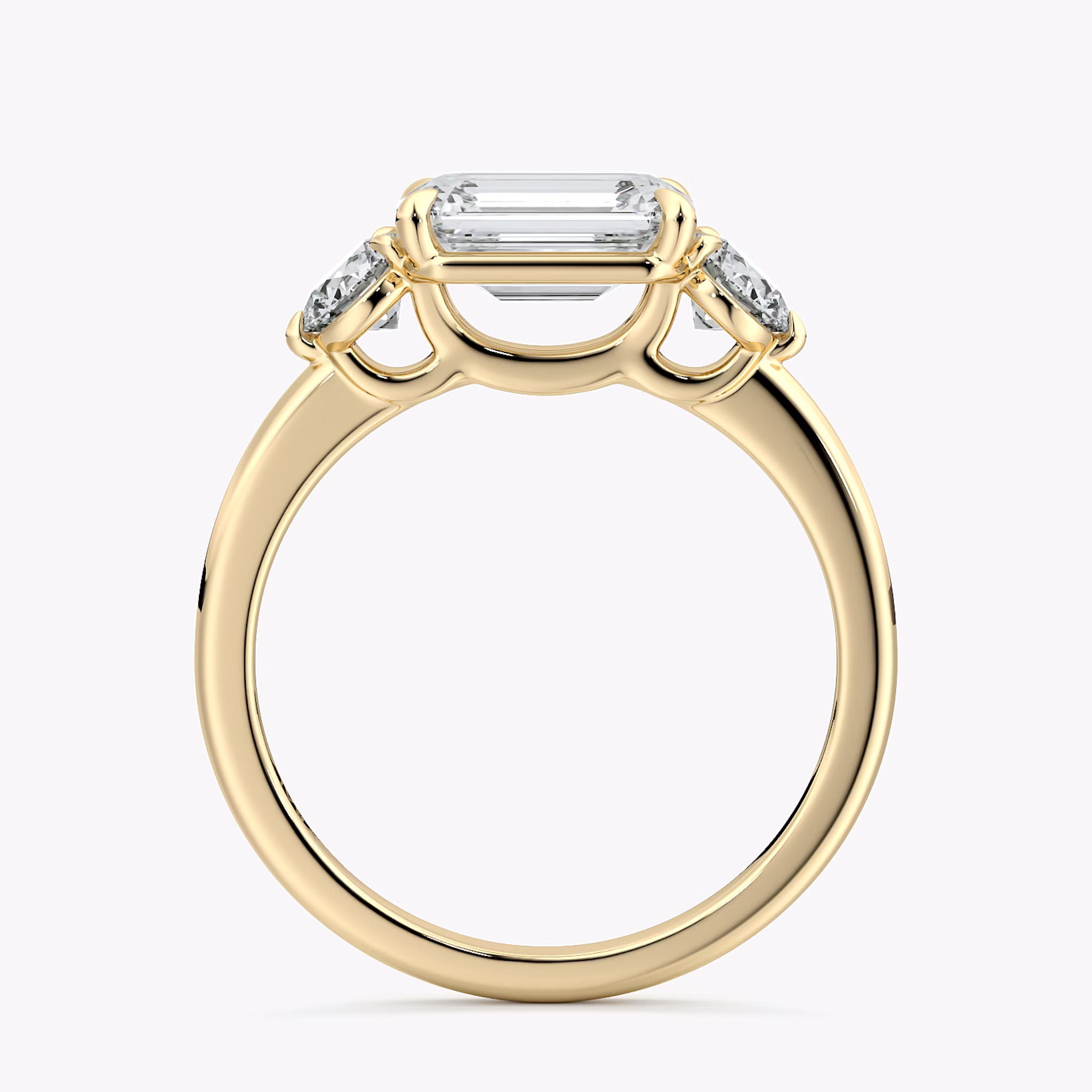 The Three Stone | Emerald | 18k | Yellow Gold | bandAccent: Plain | diamondOrientation: horizontal | sideStoneCarat: 0.25ct | sideStoneShape: Round Brilliant | caratWeight: other