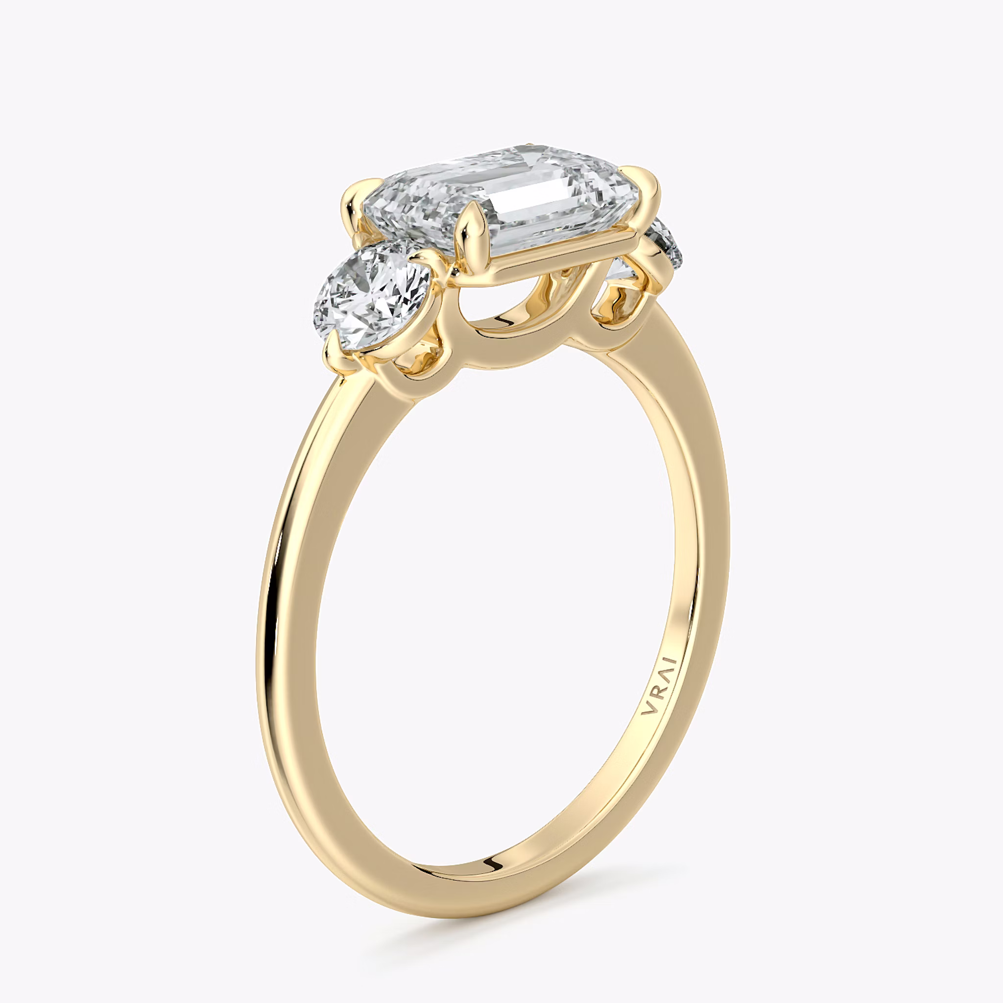 The Three Stone | Emerald | 18k | Yellow Gold | bandAccent: Plain | diamondOrientation: horizontal | sideStoneCarat: 0.25ct | sideStoneShape: Round Brilliant | caratWeight: other