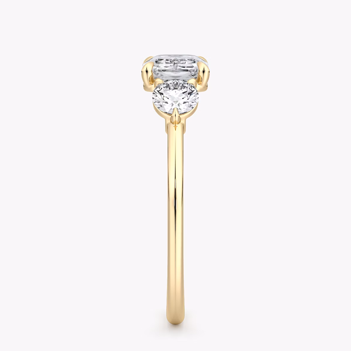 The Three Stone | Emerald | 18k | Yellow Gold | bandAccent: Plain | diamondOrientation: horizontal | sideStoneCarat: 0.25ct | sideStoneShape: Round Brilliant | caratWeight: other
