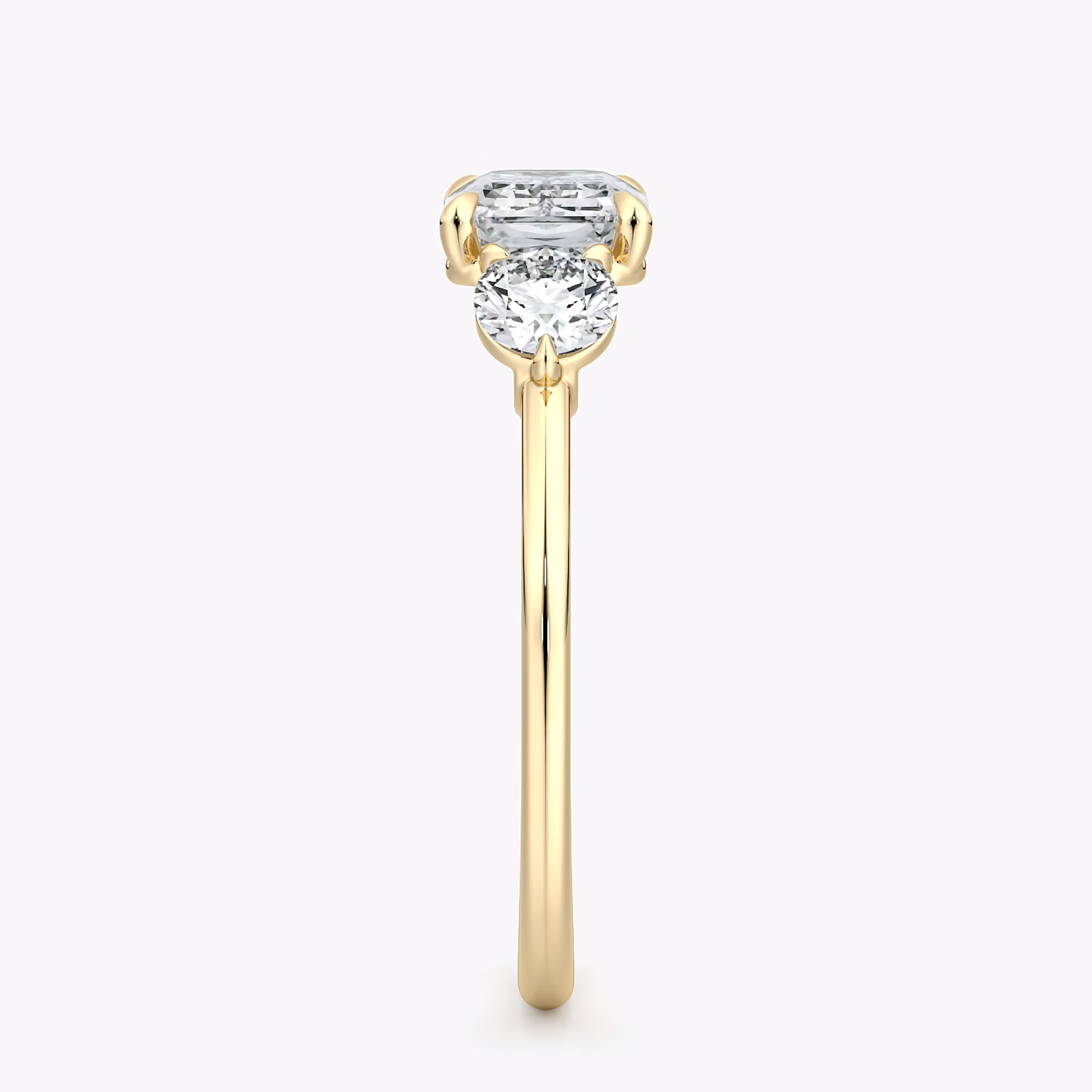 The Three Stone | Emerald | 18k | Yellow Gold | bandAccent: Plain | diamondOrientation: horizontal | sideStoneCarat: 0.25ct | sideStoneShape: Round Brilliant | caratWeight: other