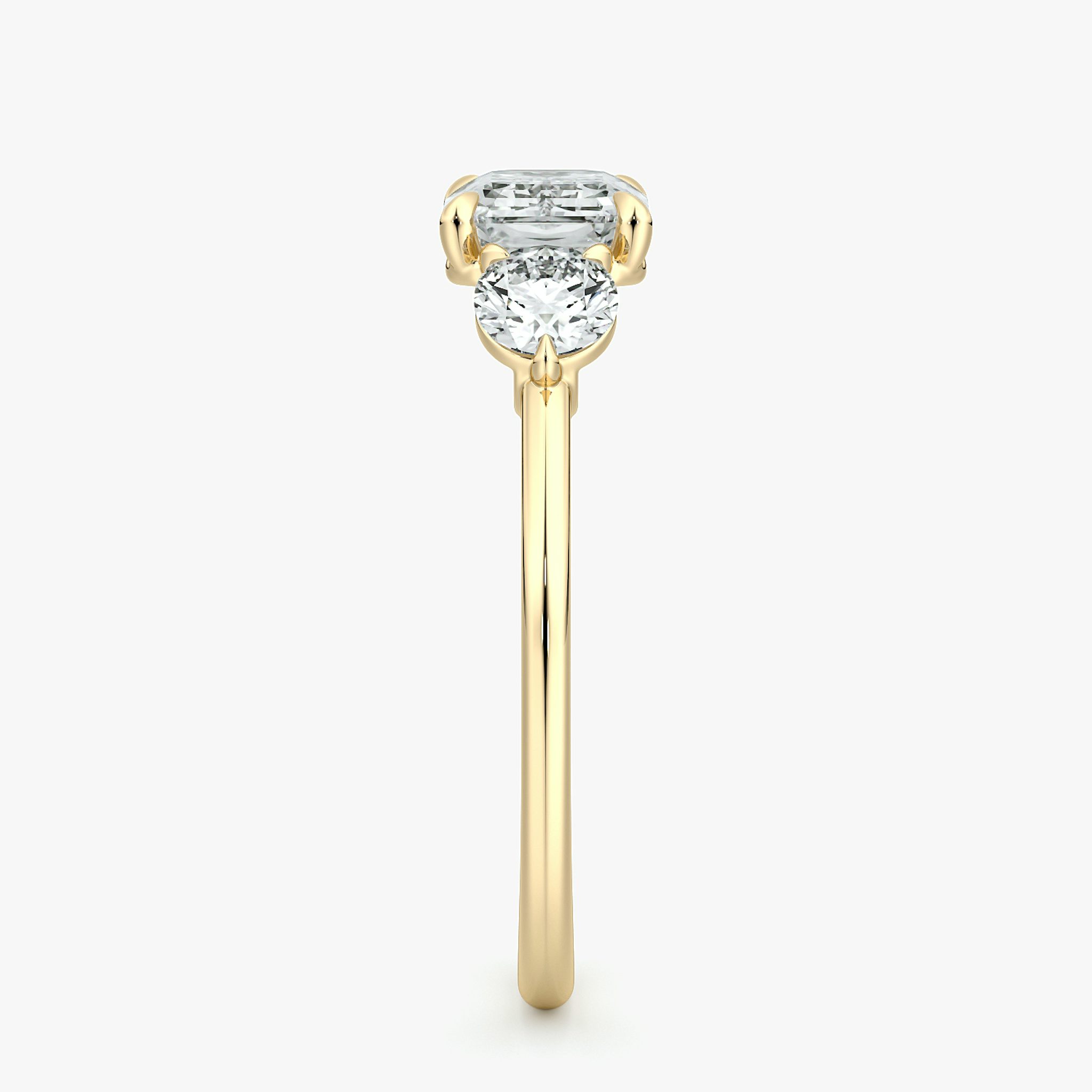 The Three Stone | Emerald | 18k | Yellow Gold | bandAccent: Plain | diamondOrientation: horizontal | sideStoneCarat: 0.25ct | sideStoneShape: Round Brilliant | caratWeight: other