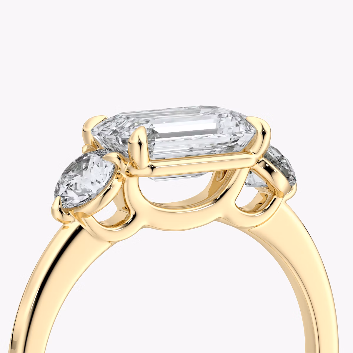 The Three Stone | Emerald | 18k | Yellow Gold | bandAccent: Plain | diamondOrientation: horizontal | sideStoneCarat: 0.25ct | sideStoneShape: Round Brilliant | caratWeight: other