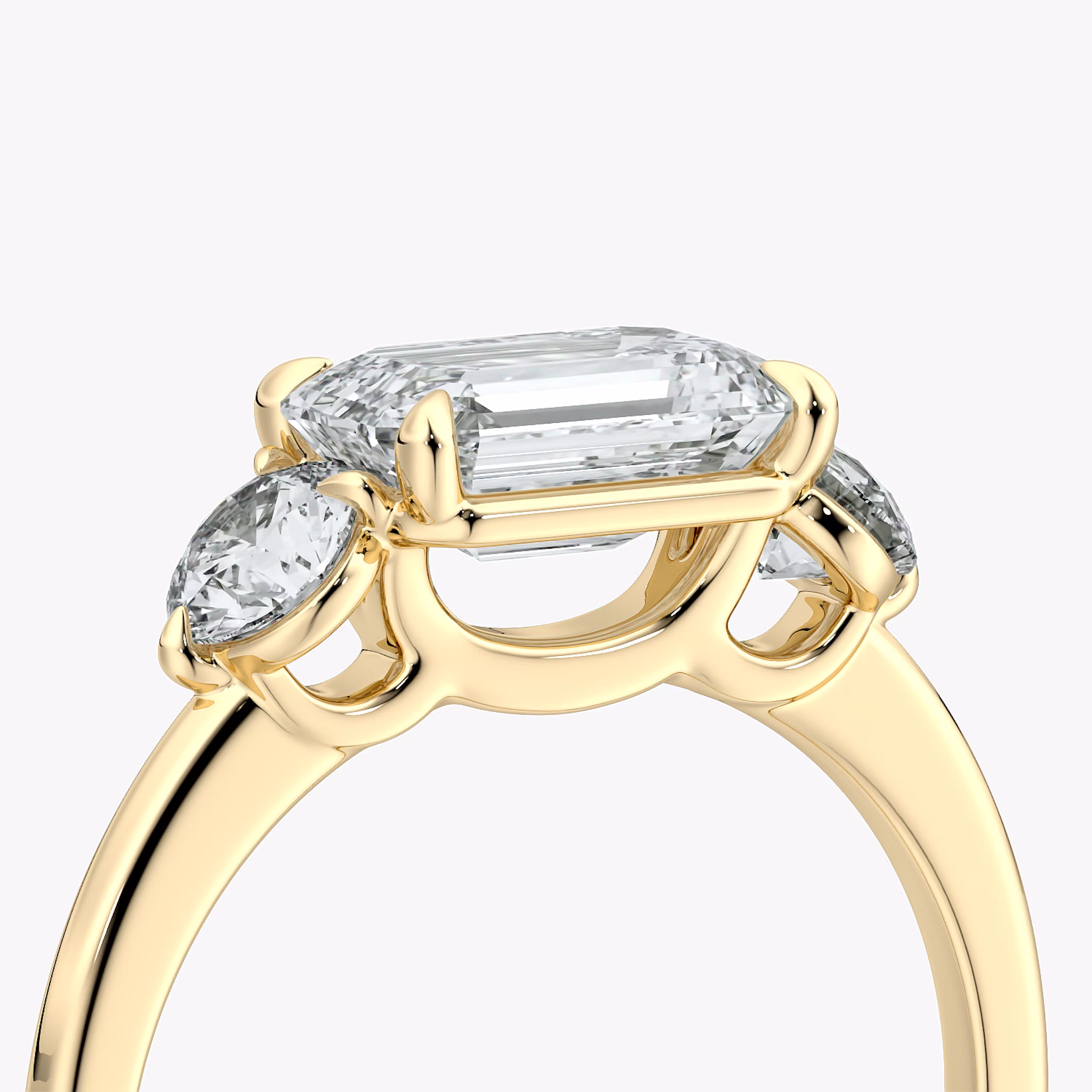 The Three Stone | Emerald | 18k | Yellow Gold | bandAccent: Plain | diamondOrientation: horizontal | sideStoneCarat: 0.25ct | sideStoneShape: Round Brilliant | caratWeight: other