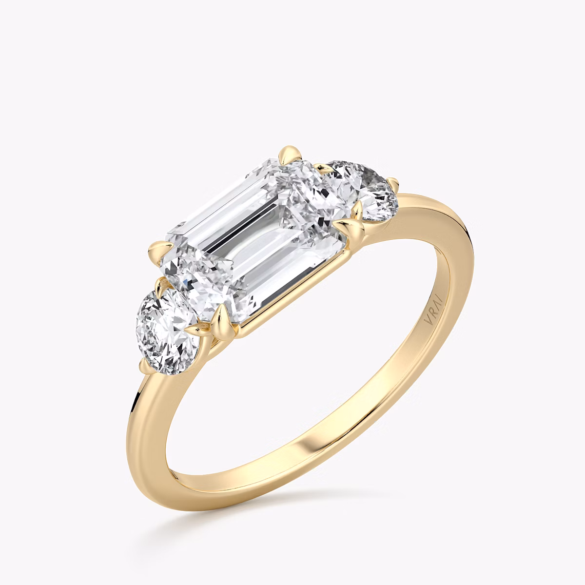The Three Stone | Emerald | 18k | Yellow Gold | bandAccent: Plain | diamondOrientation: horizontal | sideStoneCarat: 0.25ct | sideStoneShape: Round Brilliant | caratWeight: other