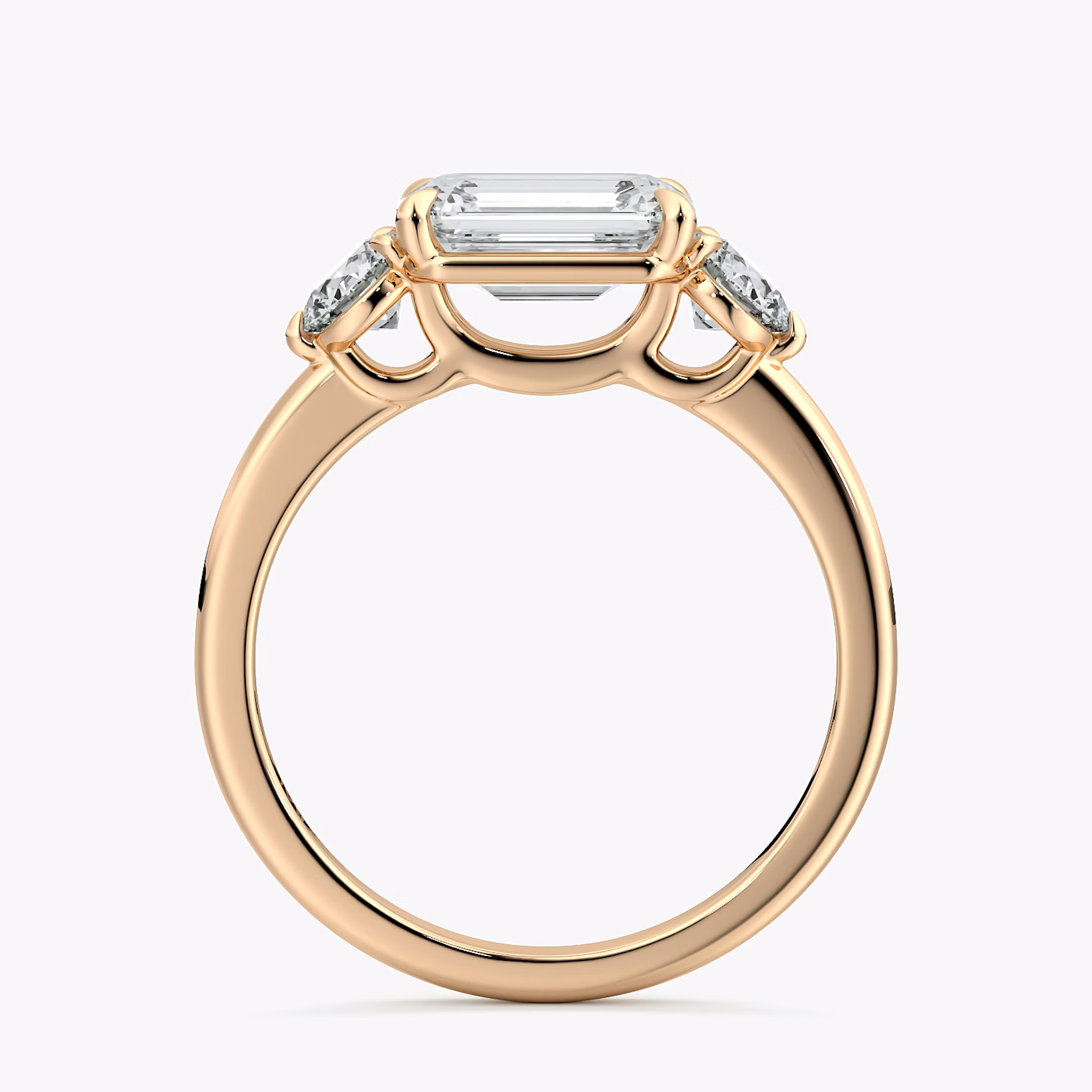 The Three Stone | Emerald | 14k | Rose Gold | bandAccent: Plain | diamondOrientation: horizontal | sideStoneCarat: 0.25ct | sideStoneShape: Round Brilliant | caratWeight: other