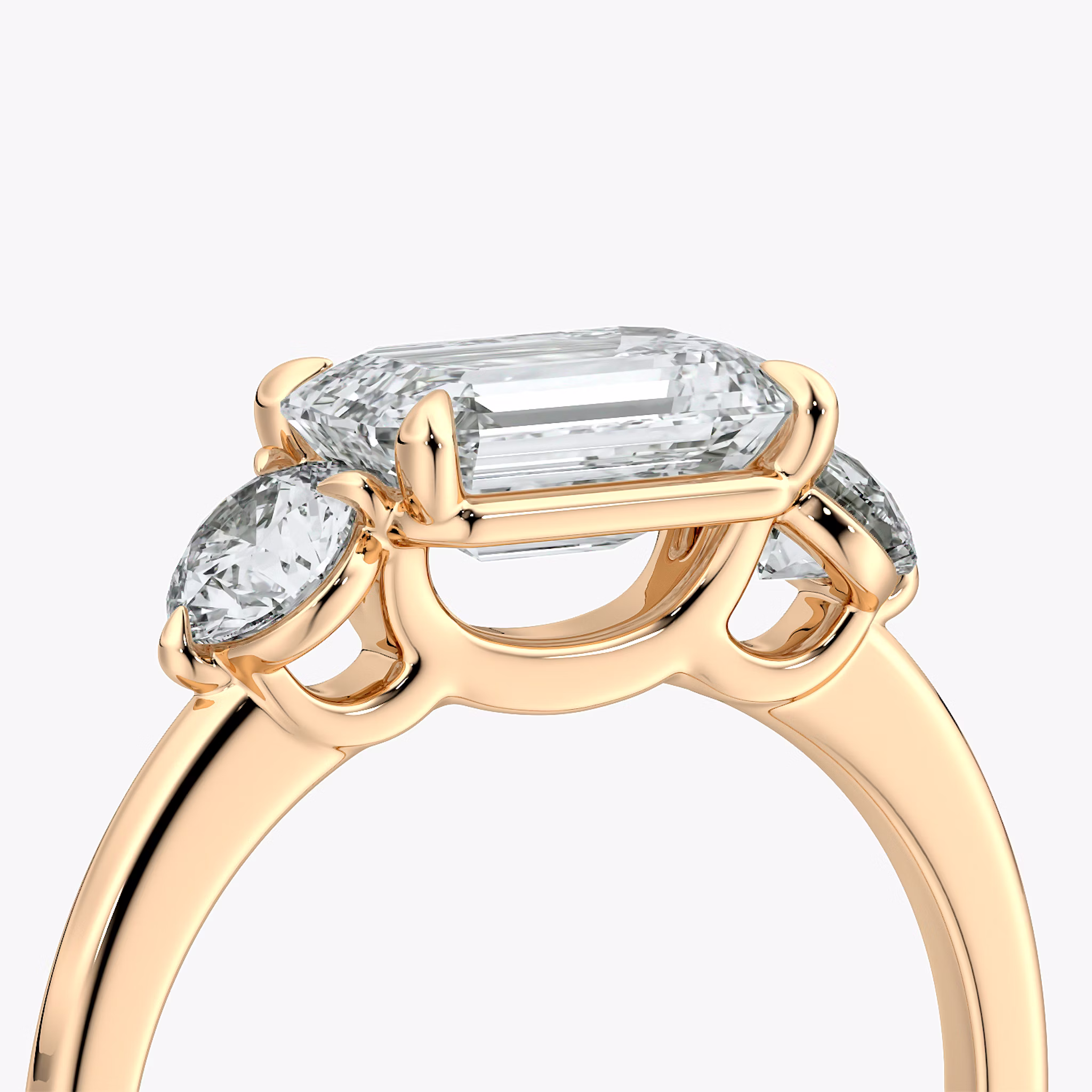 The Three Stone | Emerald | 14k | Rose Gold | bandAccent: Plain | diamondOrientation: horizontal | sideStoneCarat: 0.25ct | sideStoneShape: Round Brilliant | caratWeight: other