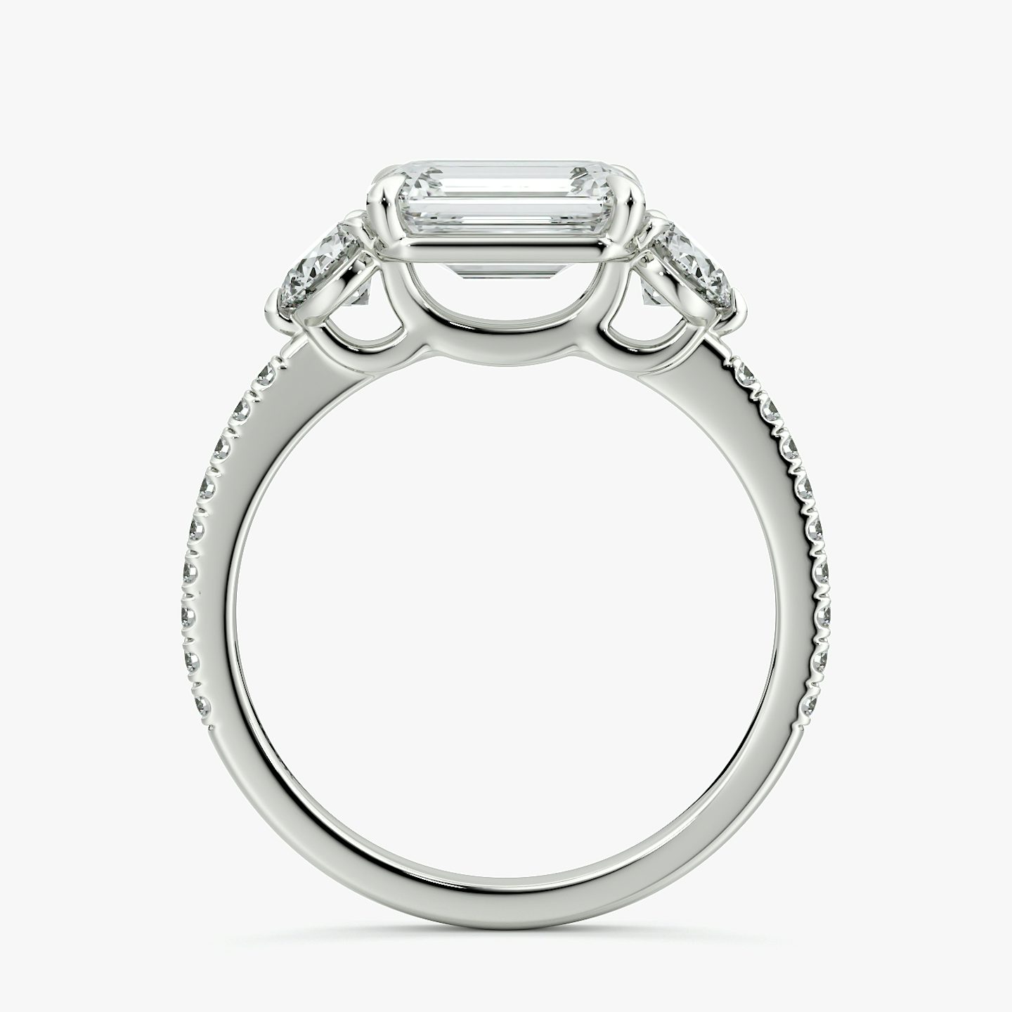 The Three Stone | Emerald | 18k | White Gold | bandAccent: Pavé | diamondOrientation: horizontal | sideStoneCarat: 0.25ct | sideStoneShape: Round Brilliant | caratWeight: other