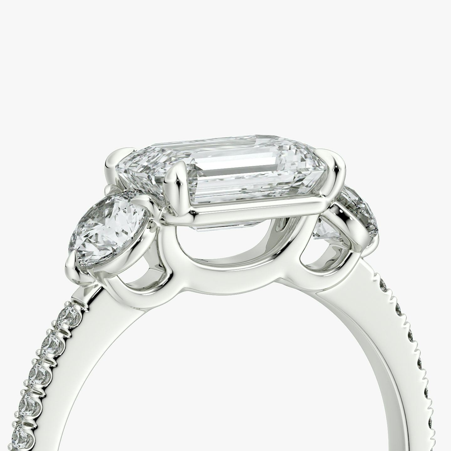 The Three Stone | Emerald | 18k | White Gold | bandAccent: Pavé | diamondOrientation: horizontal | sideStoneCarat: 0.25ct | sideStoneShape: Round Brilliant | caratWeight: other