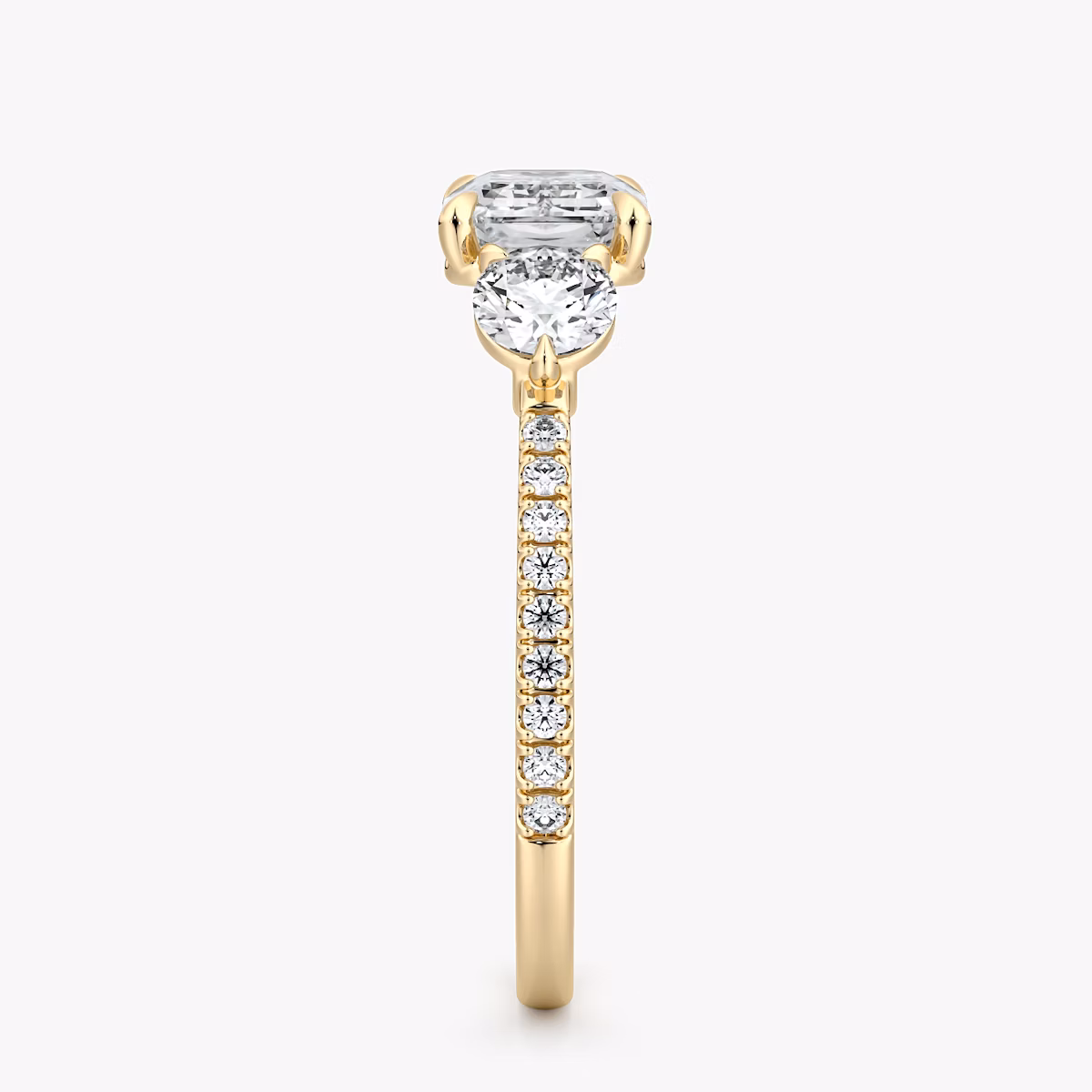 The Three Stone | Emerald | 18k | Yellow Gold | bandAccent: Pavé | diamondOrientation: horizontal | sideStoneCarat: 0.25ct | sideStoneShape: Round Brilliant | caratWeight: other