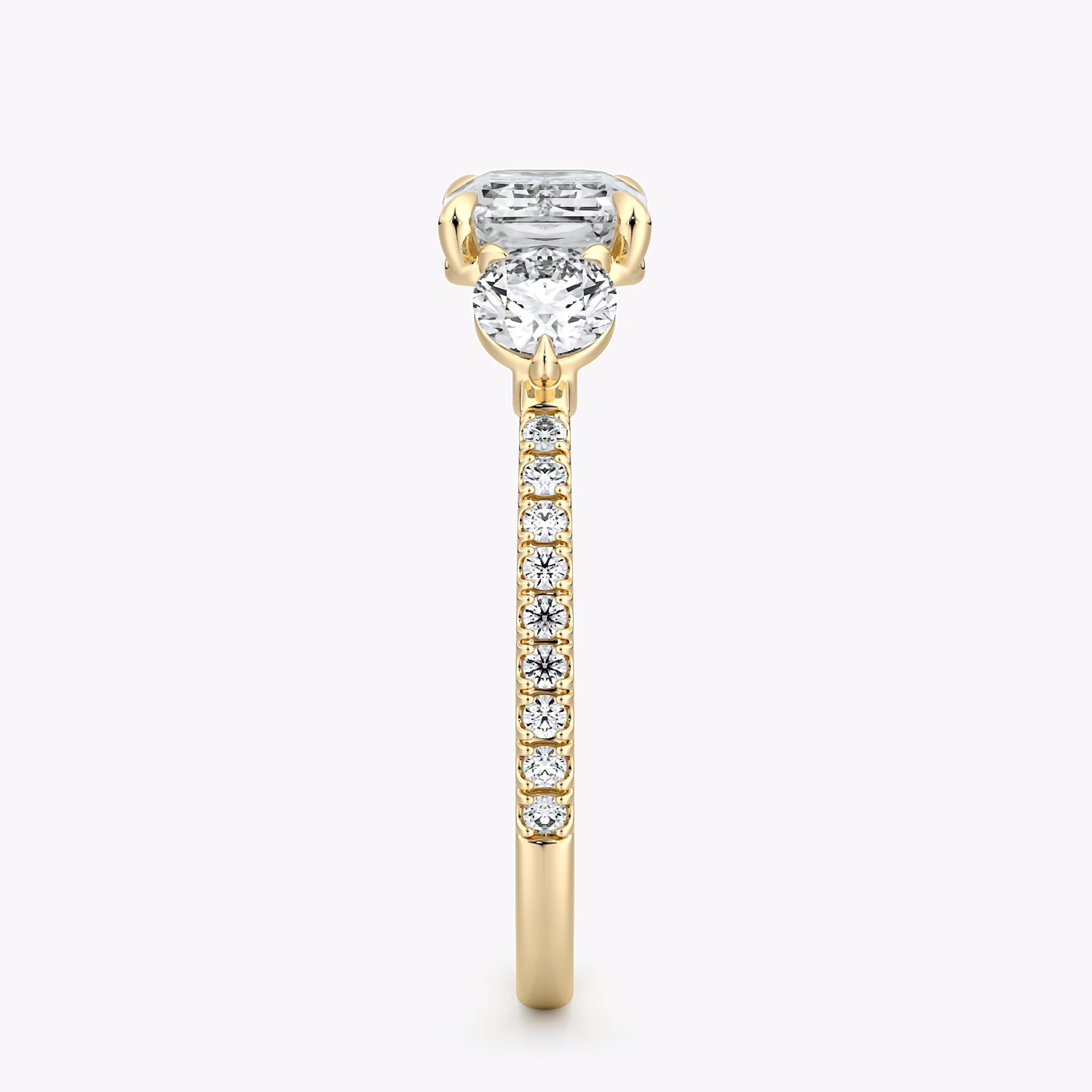 The Three Stone | Emerald | 18k | Yellow Gold | bandAccent: Pavé | diamondOrientation: horizontal | sideStoneCarat: 0.25ct | sideStoneShape: Round Brilliant | caratWeight: other