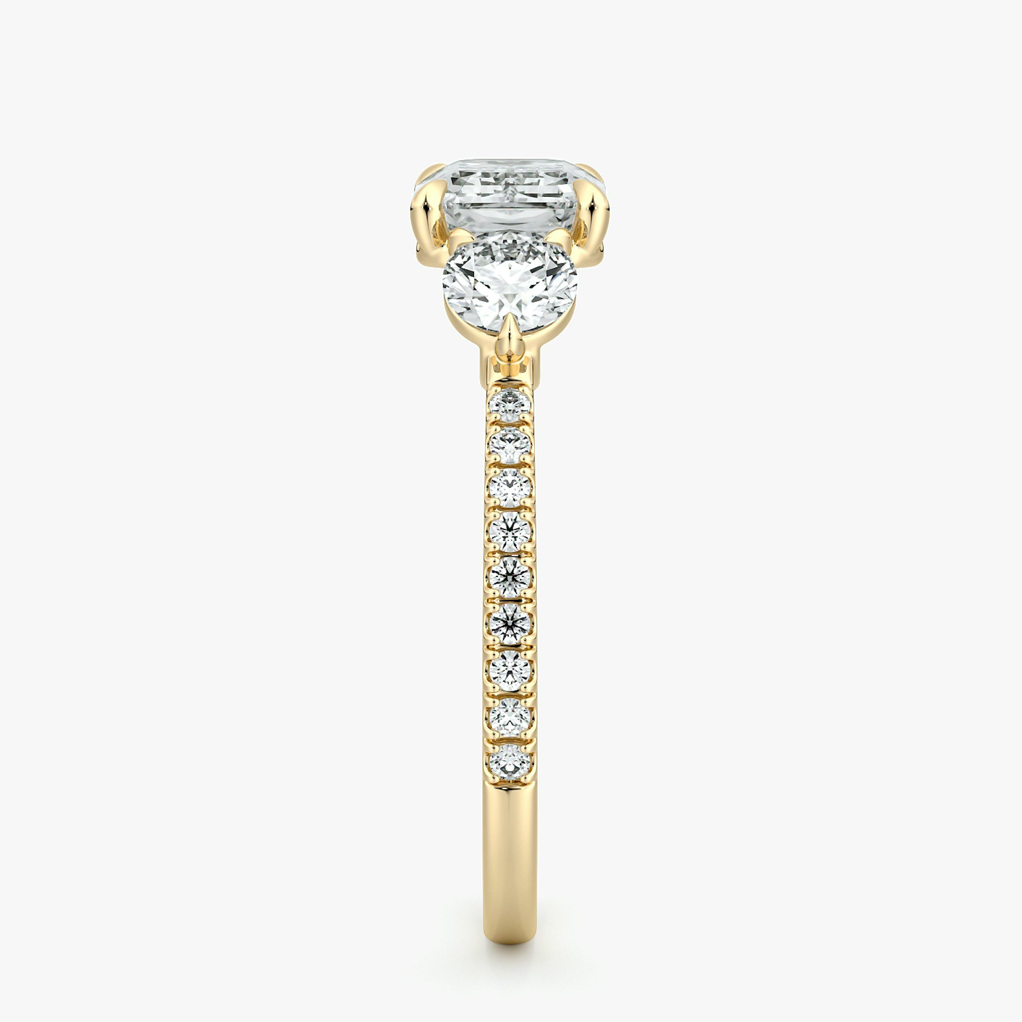 The Three Stone | Emerald | 18k | Yellow Gold | bandAccent: Pavé | diamondOrientation: horizontal | sideStoneCarat: 0.25ct | sideStoneShape: Round Brilliant | caratWeight: other