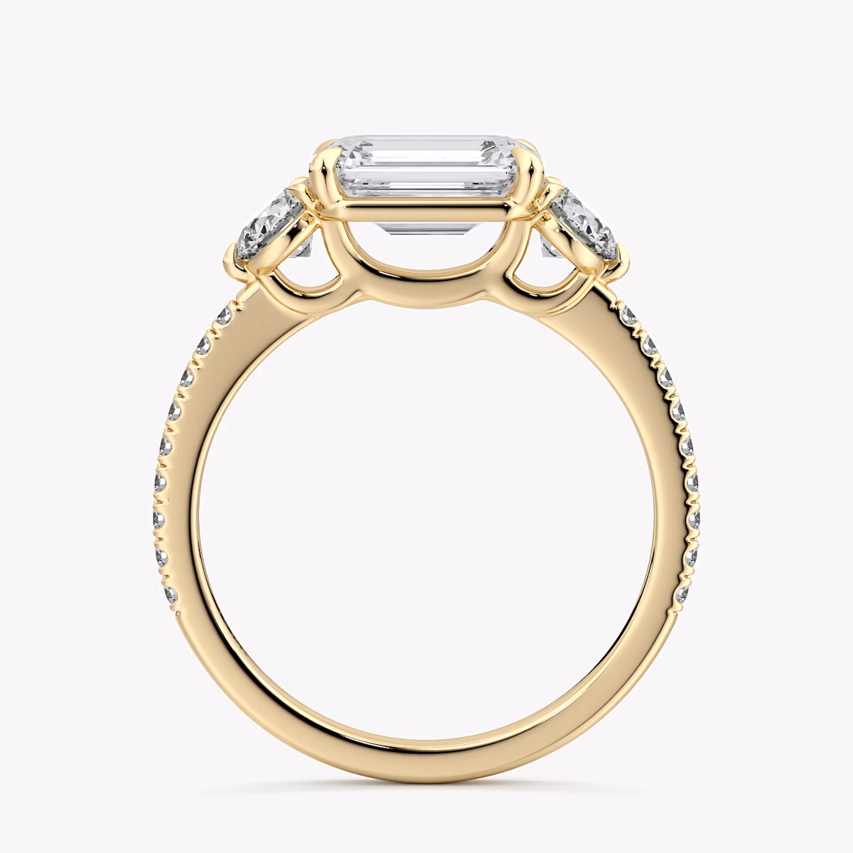 The Three Stone | Emerald | 18k | Yellow Gold | bandAccent: Pavé | diamondOrientation: horizontal | sideStoneCarat: 0.25ct | sideStoneShape: Round Brilliant | caratWeight: other