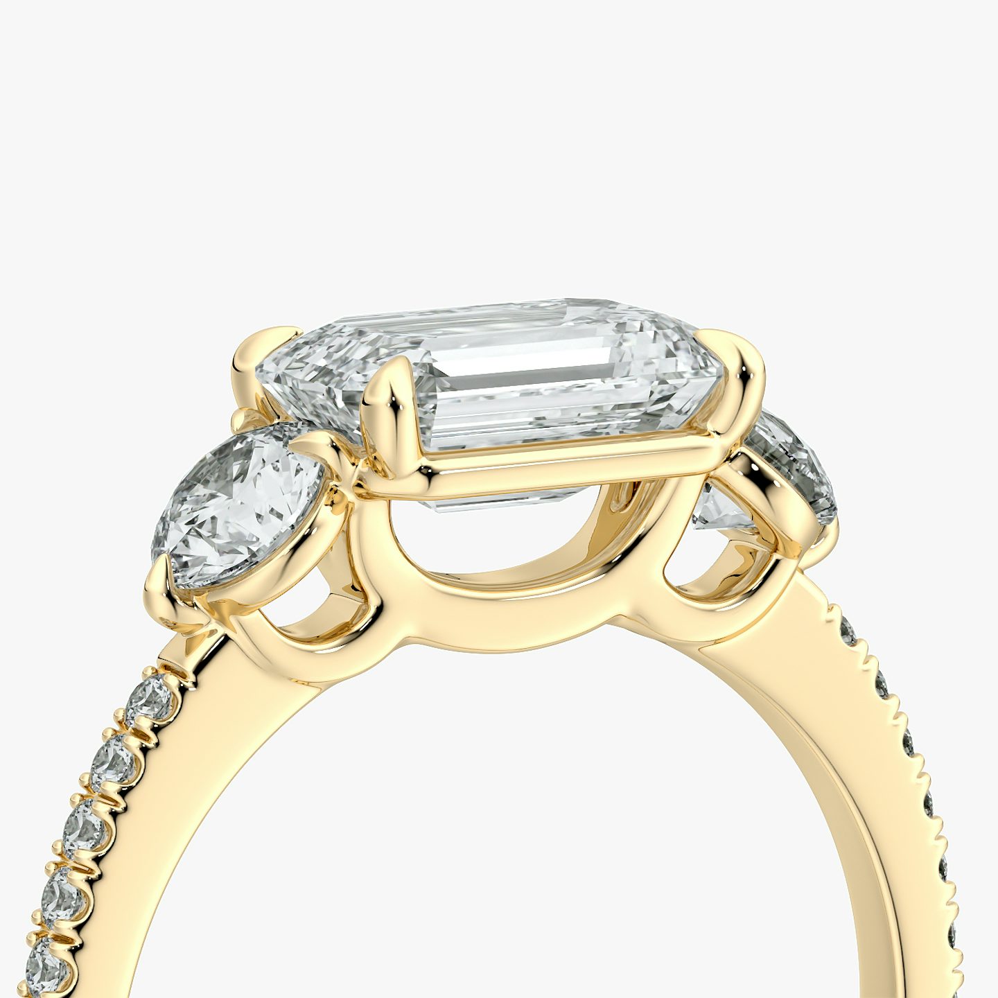 The Three Stone | Emerald | 18k | Yellow Gold | bandAccent: Pavé | diamondOrientation: horizontal | sideStoneCarat: 0.25ct | sideStoneShape: Round Brilliant | caratWeight: other