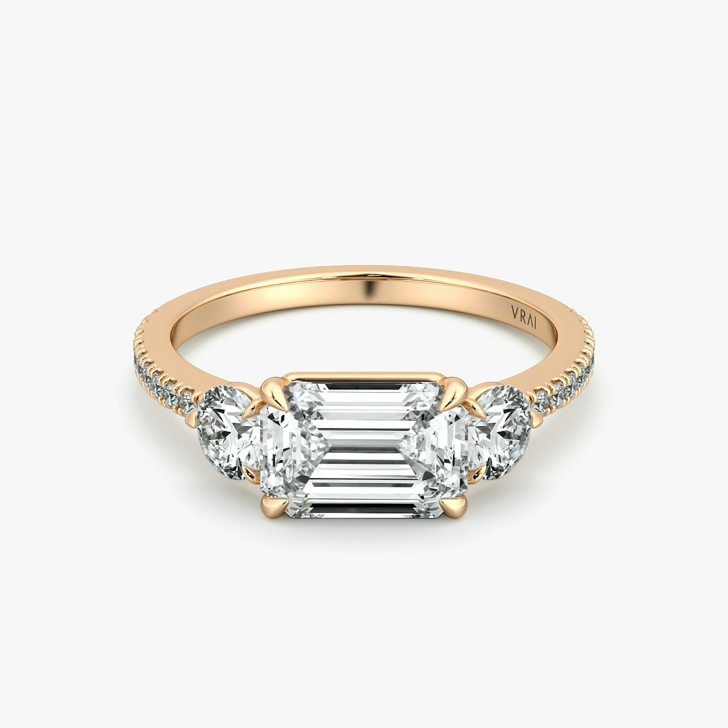 The Three Stone | Emerald | 14k | Rose Gold | bandAccent: Pavé | diamondOrientation: horizontal | sideStoneCarat: 0.25ct | sideStoneShape: Round Brilliant | caratWeight: other