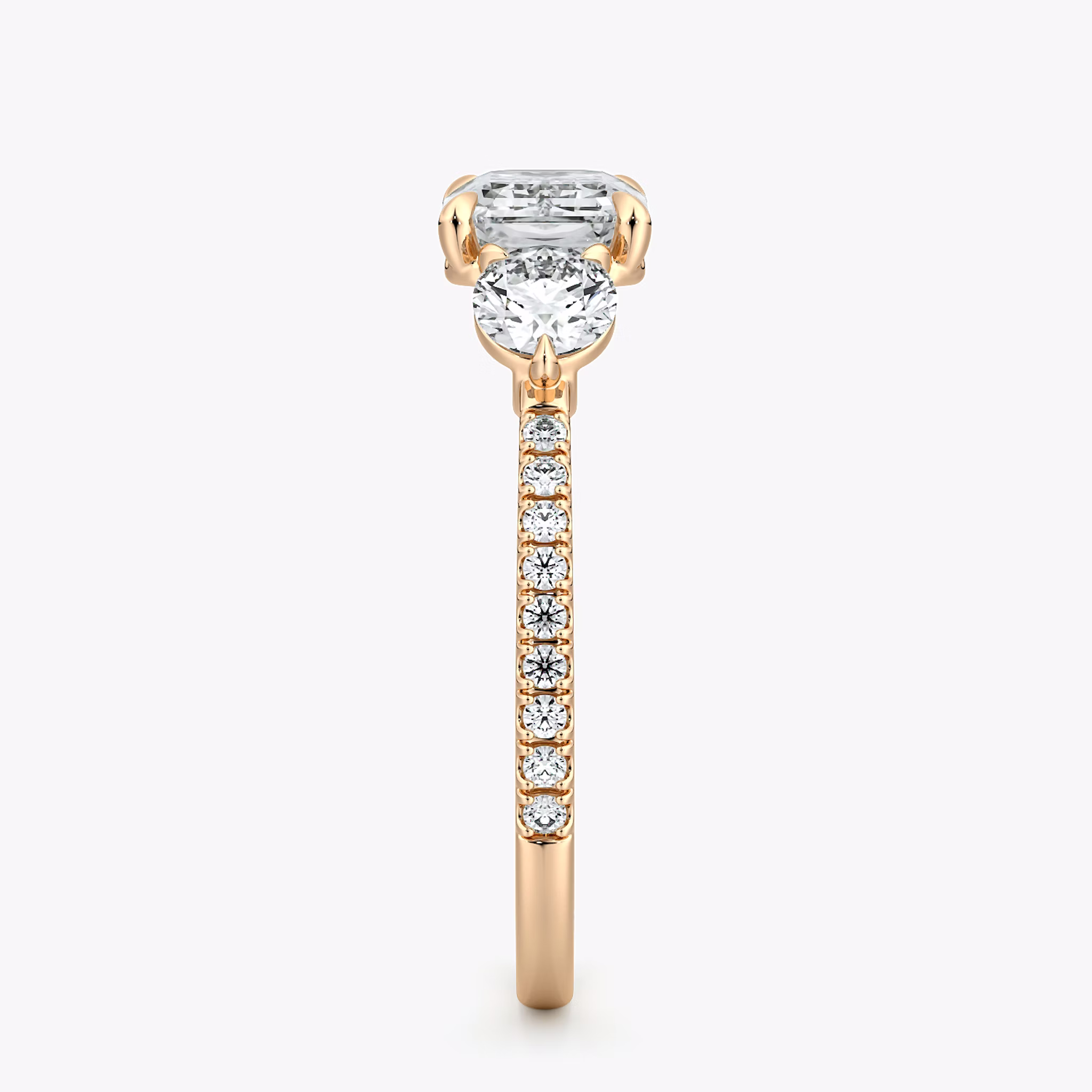 The Three Stone | Emerald | 14k | Rose Gold | bandAccent: Pavé | diamondOrientation: horizontal | sideStoneCarat: 0.25ct | sideStoneShape: Round Brilliant | caratWeight: other