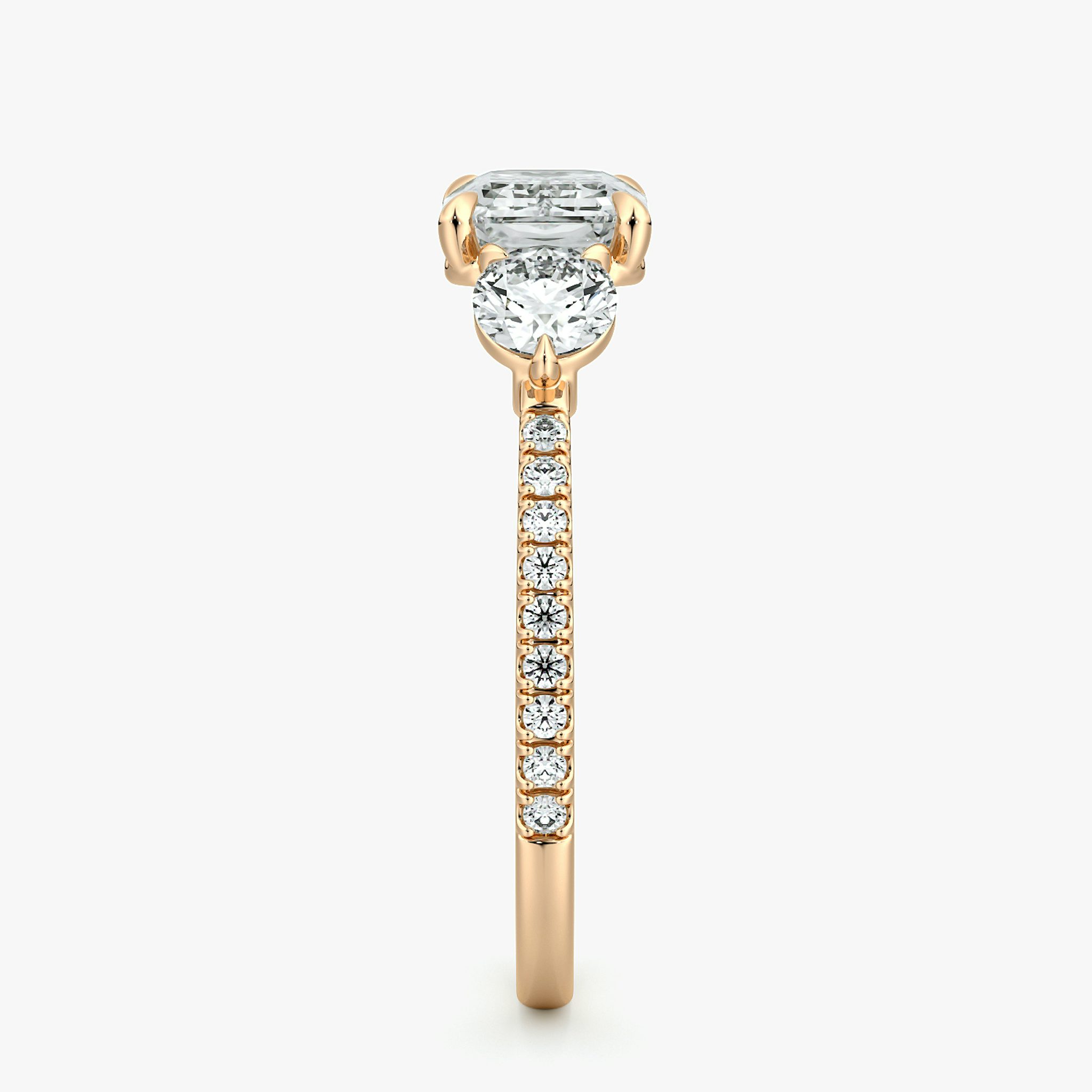 The Three Stone | Emerald | 14k | Rose Gold | bandAccent: Pavé | diamondOrientation: horizontal | sideStoneCarat: 0.25ct | sideStoneShape: Round Brilliant | caratWeight: other