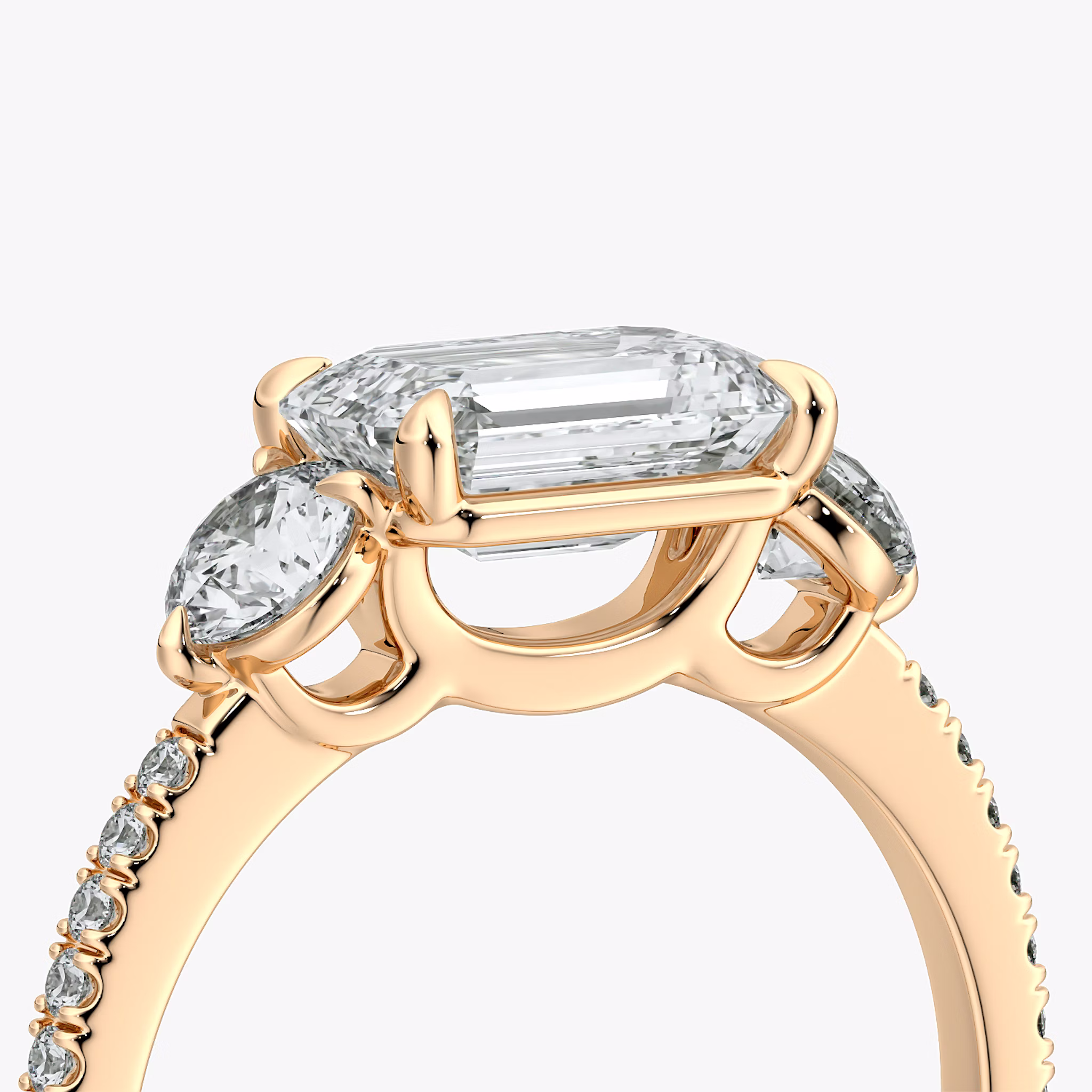 The Three Stone | Emerald | 14k | Rose Gold | bandAccent: Pavé | diamondOrientation: horizontal | sideStoneCarat: 0.25ct | sideStoneShape: Round Brilliant | caratWeight: other