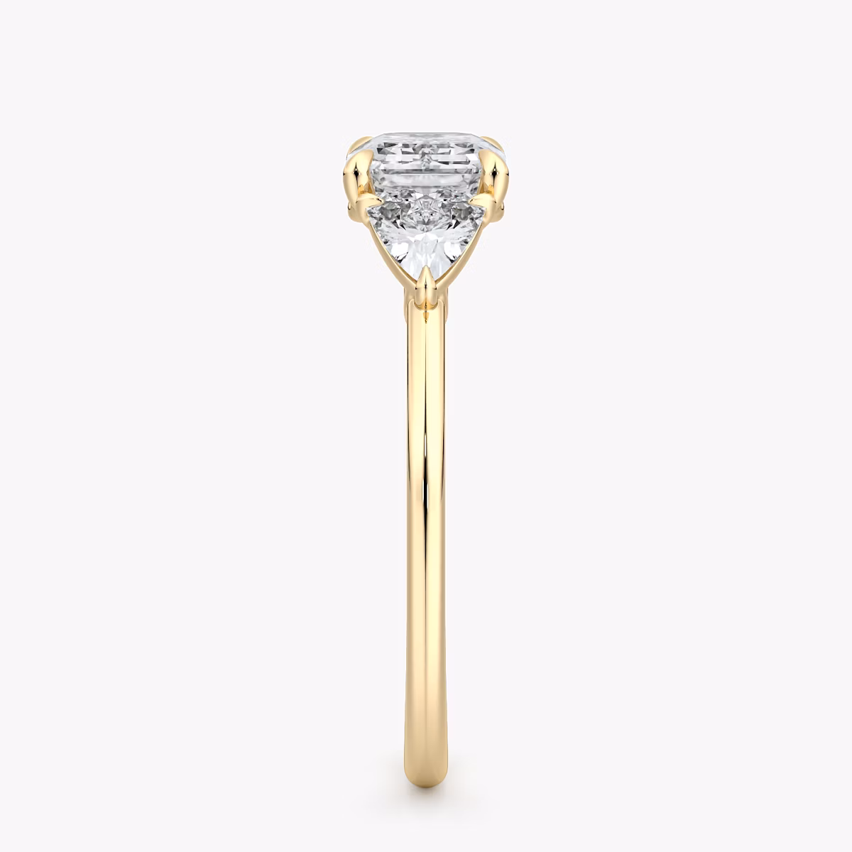 The Three Stone | Emerald | 18k | Yellow Gold | bandAccent: Plain | diamondOrientation: horizontal | sideStoneCarat: 0.25ct | sideStoneShape: Trillion | caratWeight: other