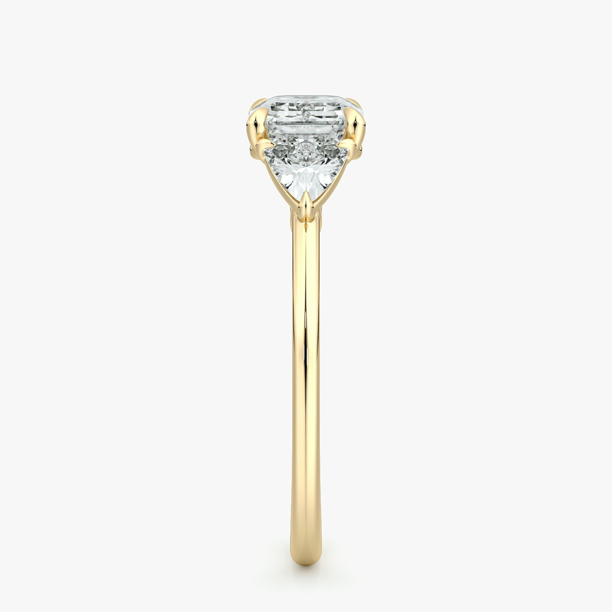 The Three Stone | Emerald | 18k | Yellow Gold | bandAccent: Plain | diamondOrientation: horizontal | sideStoneCarat: 0.25ct | sideStoneShape: Trillion | caratWeight: other