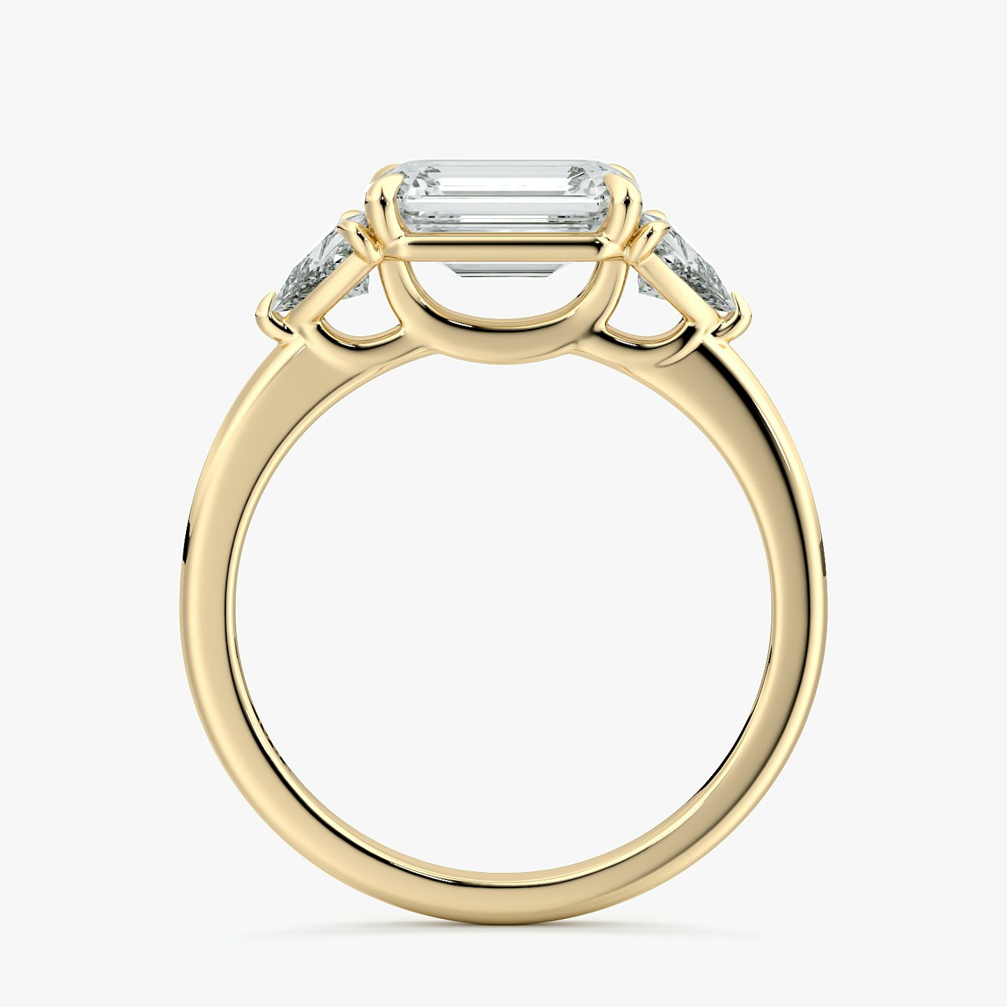 The Three Stone | Emerald | 18k | Yellow Gold | bandAccent: Plain | diamondOrientation: horizontal | sideStoneCarat: 0.25ct | sideStoneShape: Trillion | caratWeight: other