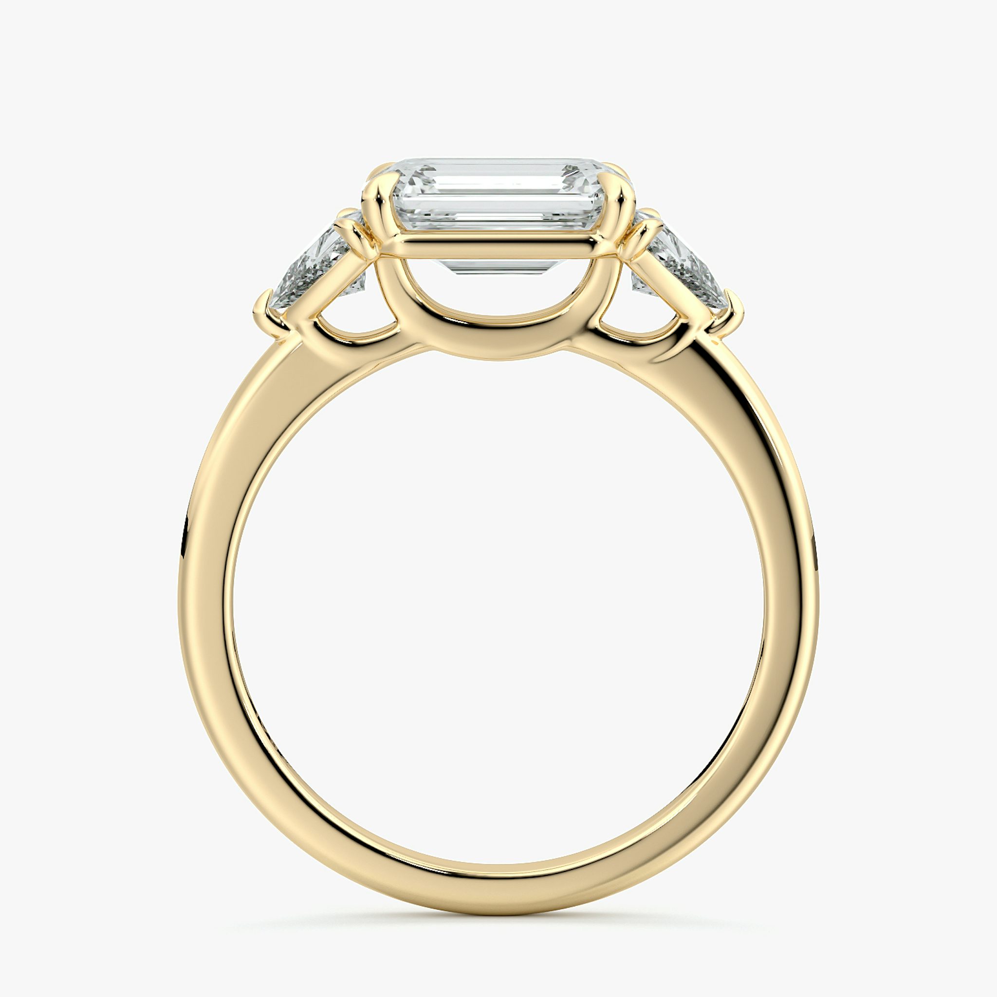 The Three Stone | Emerald | 18k | Yellow Gold | bandAccent: Plain | diamondOrientation: horizontal | sideStoneCarat: 0.25ct | sideStoneShape: Trillion | caratWeight: other