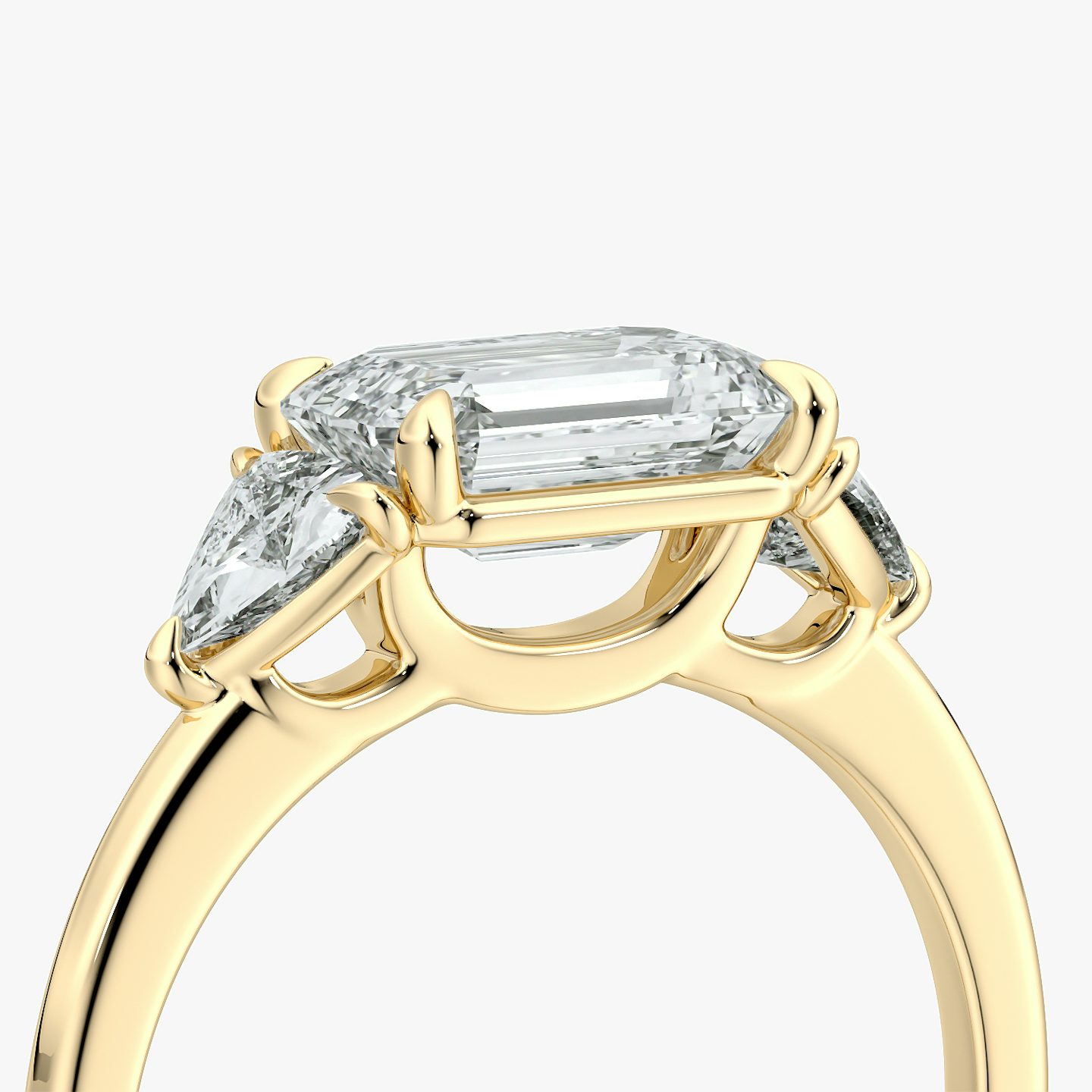 The Three Stone | Emerald | 18k | Yellow Gold | bandAccent: Plain | diamondOrientation: horizontal | sideStoneCarat: 0.25ct | sideStoneShape: Trillion | caratWeight: other