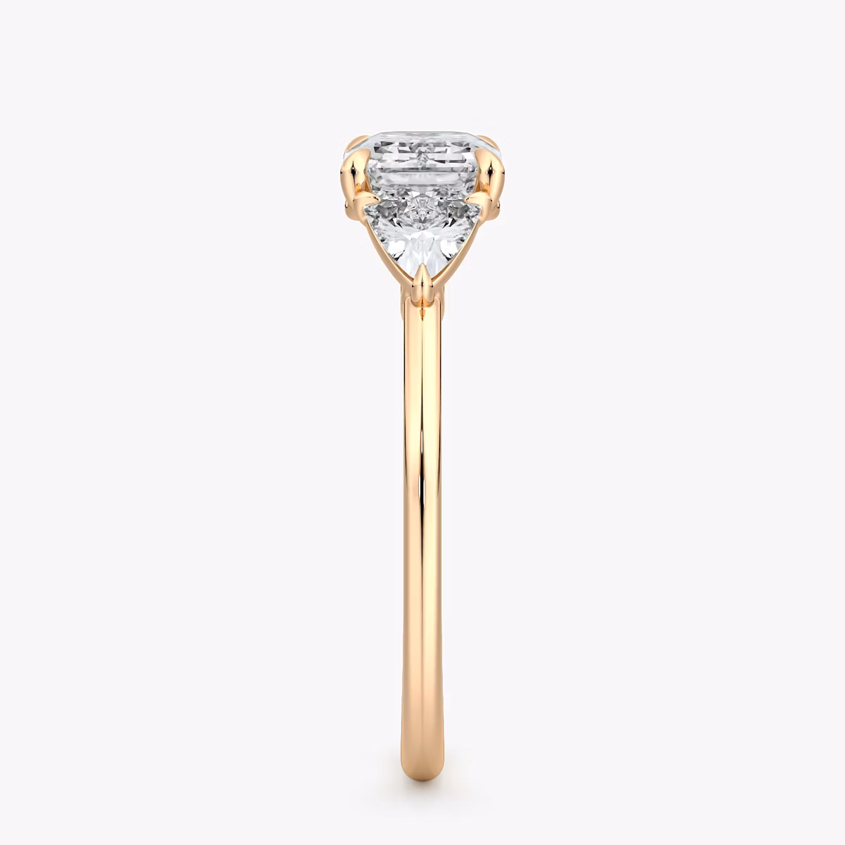 The Three Stone | Emerald | 14k | Rose Gold | bandAccent: Plain | diamondOrientation: horizontal | sideStoneCarat: 0.25ct | sideStoneShape: Trillion | caratWeight: other