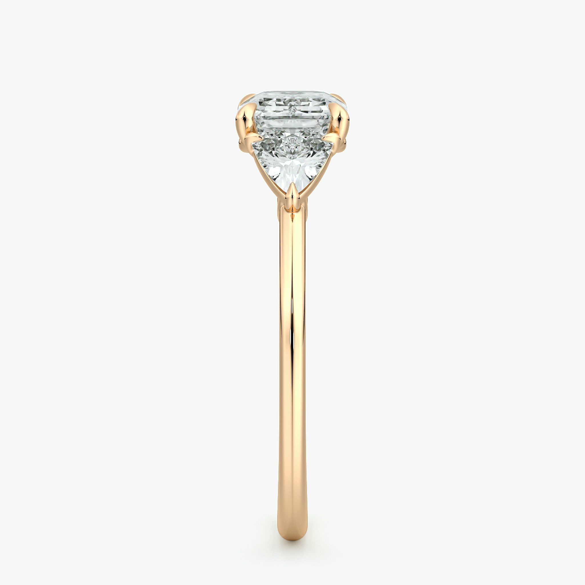 The Three Stone | Emerald | 14k | Rose Gold | bandAccent: Plain | diamondOrientation: horizontal | sideStoneCarat: 0.25ct | sideStoneShape: Trillion | caratWeight: other