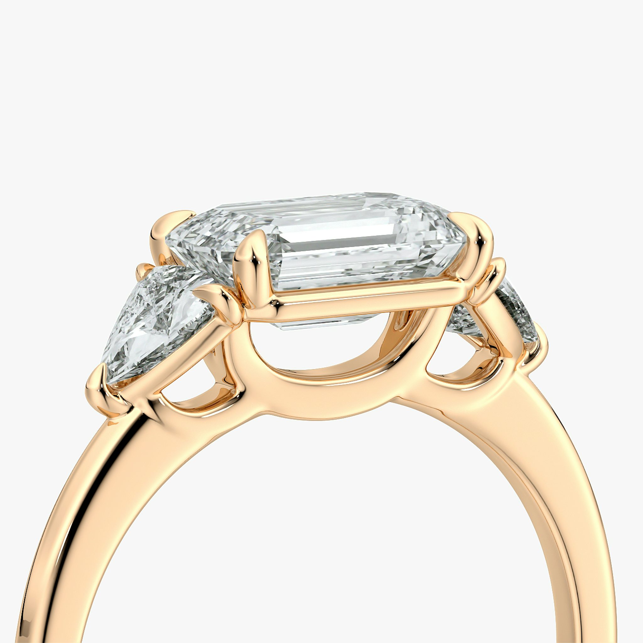 The Three Stone | Emerald | 14k | Rose Gold | bandAccent: Plain | diamondOrientation: horizontal | sideStoneCarat: 0.25ct | sideStoneShape: Trillion | caratWeight: other