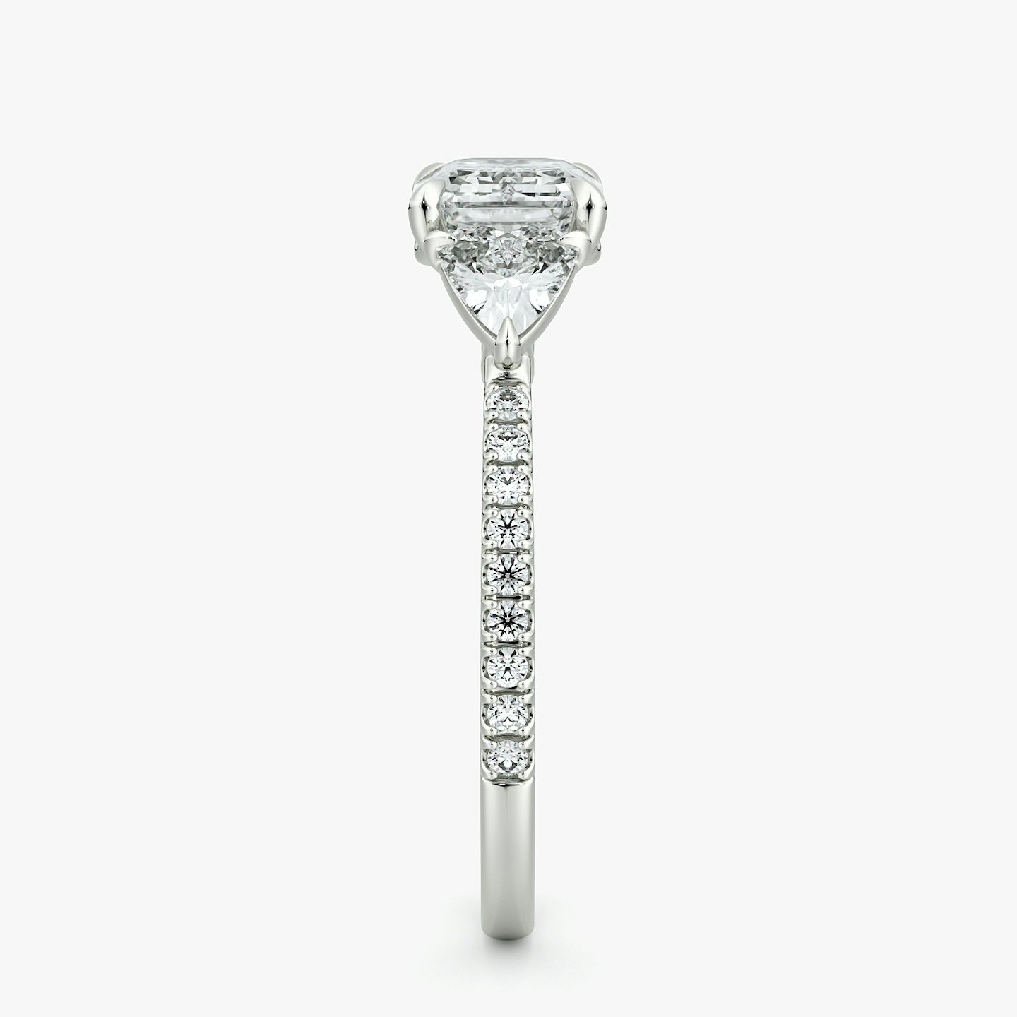The Three Stone | Emerald | 18k | White Gold | bandAccent: Pavé | diamondOrientation: horizontal | sideStoneCarat: 0.25ct | sideStoneShape: Trillion | caratWeight: other