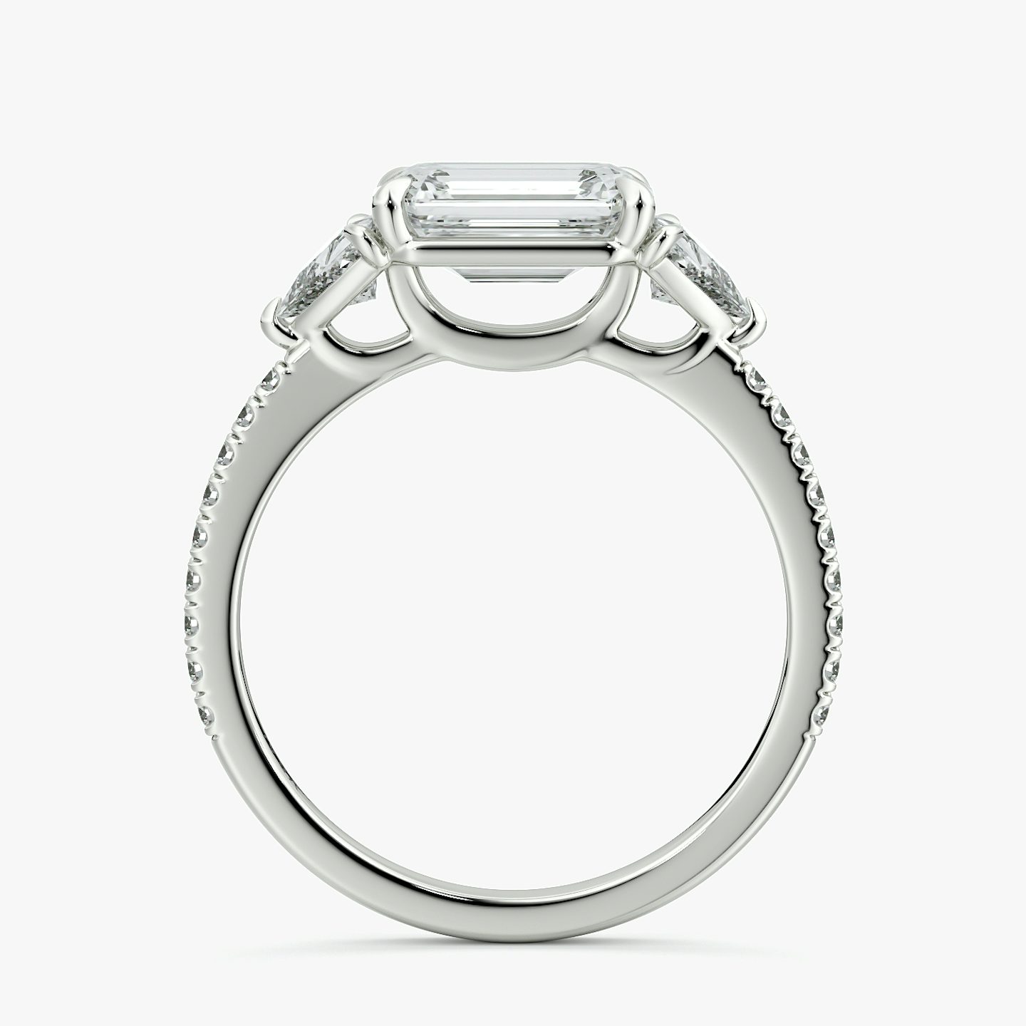 The Three Stone | Emerald | 18k | White Gold | bandAccent: Pavé | diamondOrientation: horizontal | sideStoneCarat: 0.25ct | sideStoneShape: Trillion | caratWeight: other