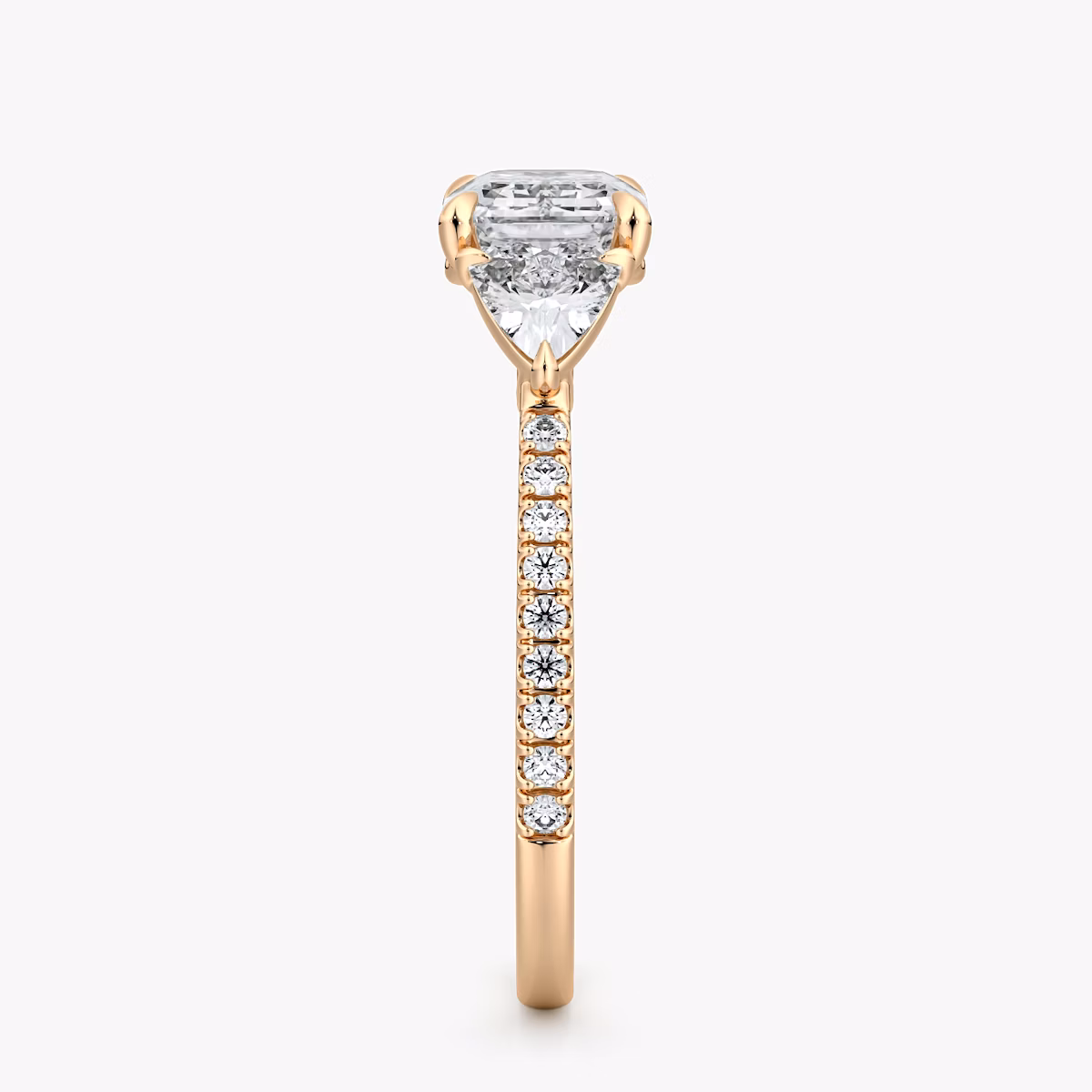 The Three Stone | Emerald | 14k | Rose Gold | bandAccent: Pavé | diamondOrientation: horizontal | sideStoneCarat: 0.25ct | sideStoneShape: Trillion | caratWeight: other