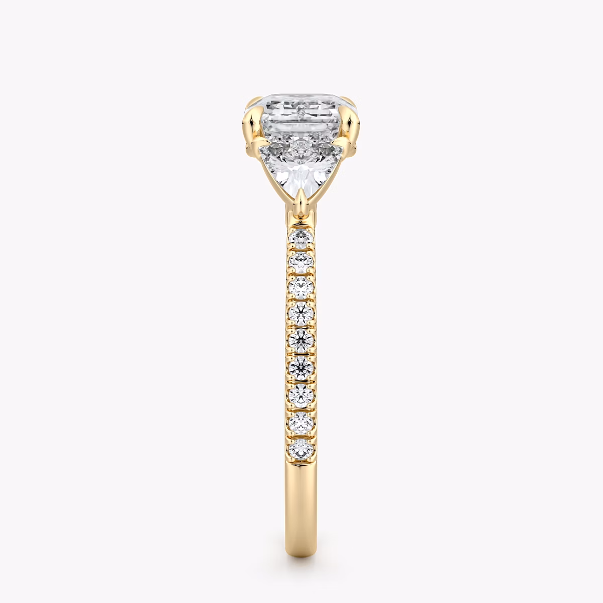 The Three Stone | Emerald | 18k | Yellow Gold | bandAccent: Pavé | diamondOrientation: horizontal | sideStoneCarat: 0.25ct | sideStoneShape: Trillion | caratWeight: other