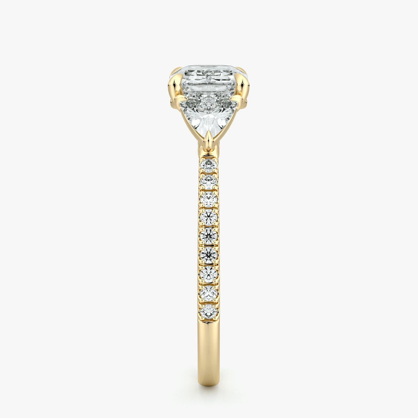 The Three Stone | Emerald | 18k | Yellow Gold | bandAccent: Pavé | diamondOrientation: horizontal | sideStoneCarat: 0.25ct | sideStoneShape: Trillion | caratWeight: other