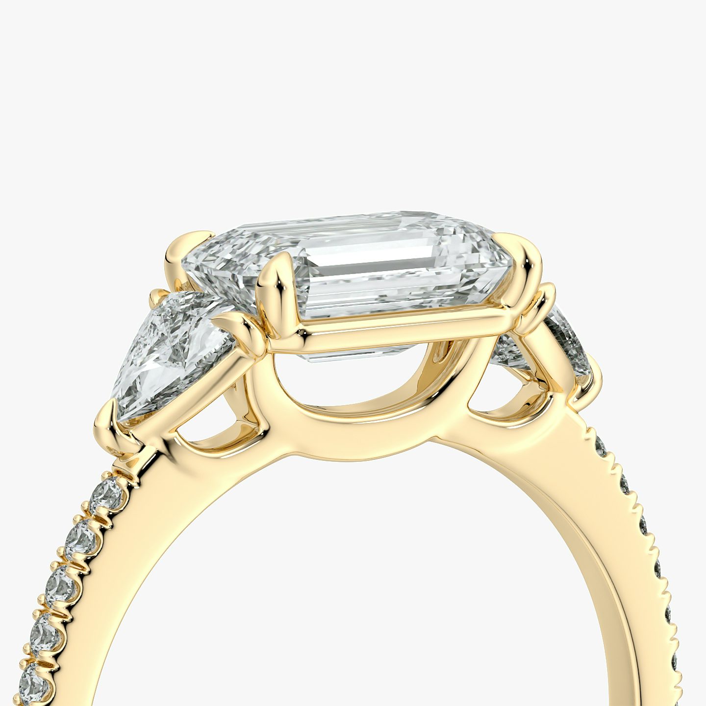The Three Stone | Emerald | 18k | Yellow Gold | bandAccent: Pavé | diamondOrientation: horizontal | sideStoneCarat: 0.25ct | sideStoneShape: Trillion | caratWeight: other