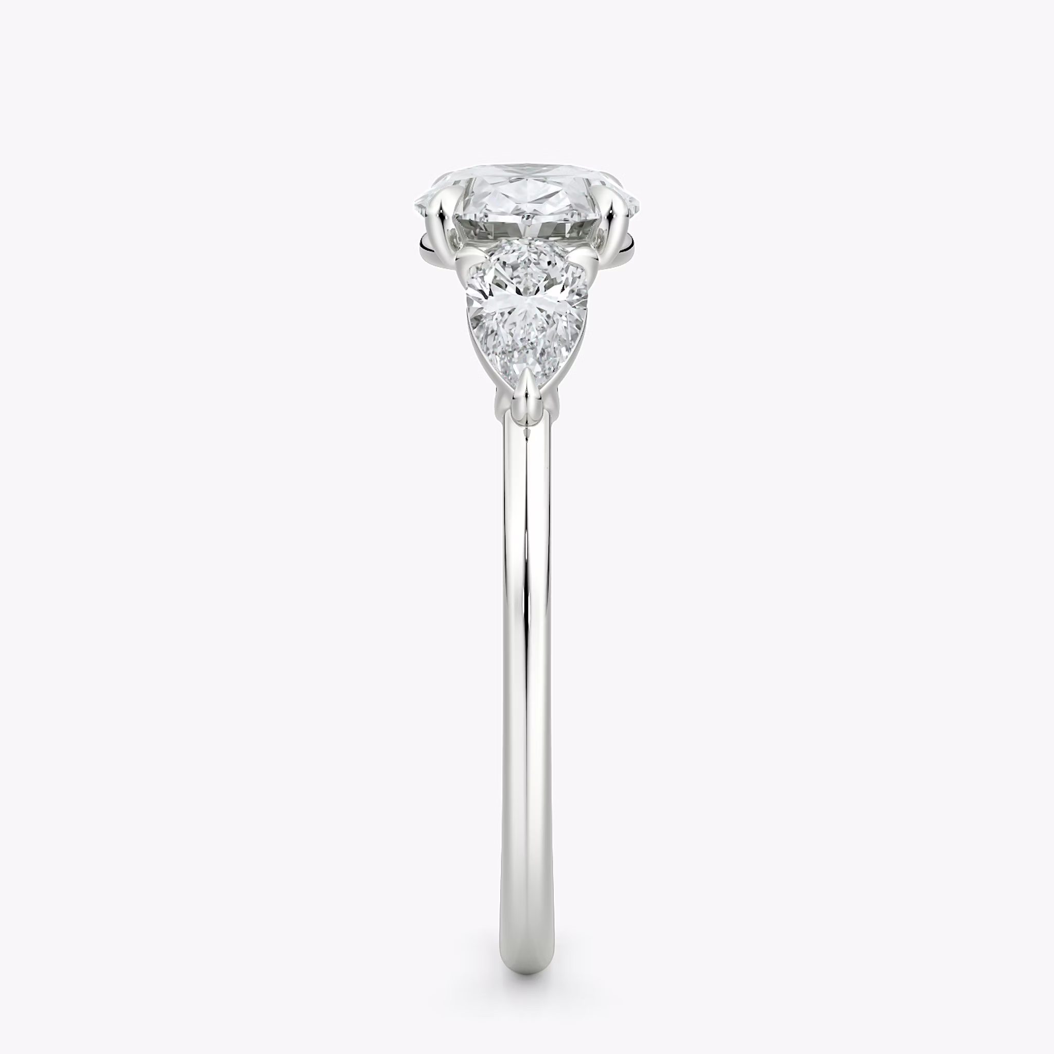 The Three Stone | Oval | 18k | White Gold | bandAccent: Plain | diamondOrientation: horizontal | sideStoneCarat: 0.25ct | sideStoneShape: Pear | caratWeight: other