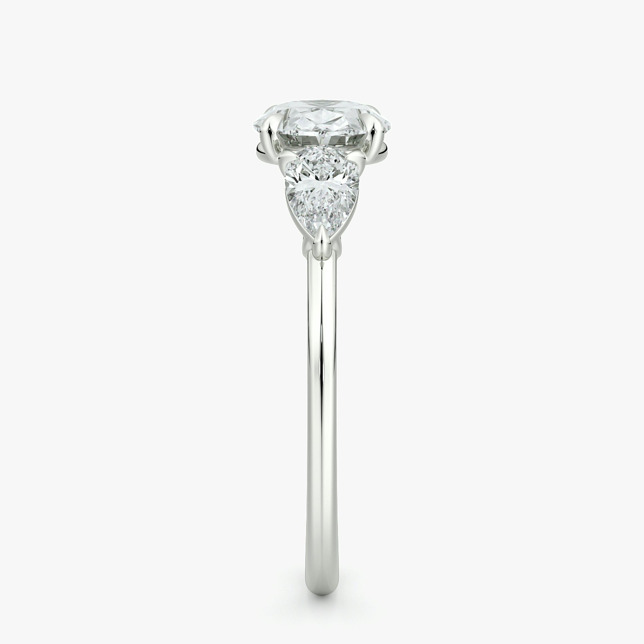The Three Stone | Oval | 18k | White Gold | bandAccent: Plain | diamondOrientation: horizontal | sideStoneCarat: 0.25ct | sideStoneShape: Pear | caratWeight: other