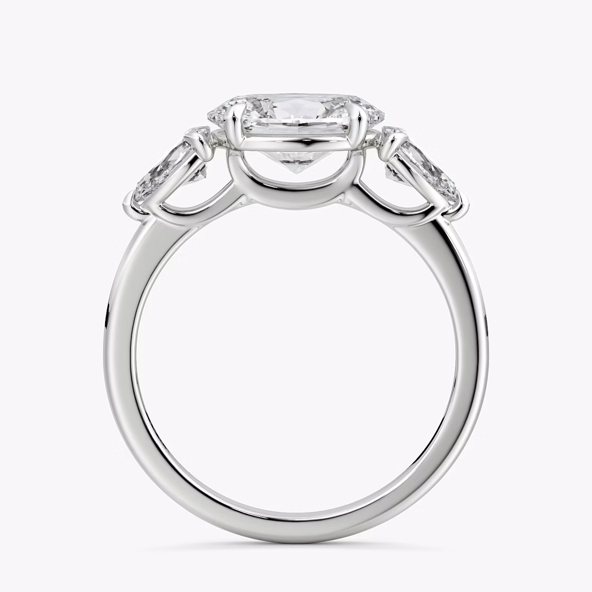 The Three Stone | Oval | Platinum | bandAccent: Plain | diamondOrientation: horizontal | sideStoneCarat: 0.25ct | sideStoneShape: Pear | caratWeight: other