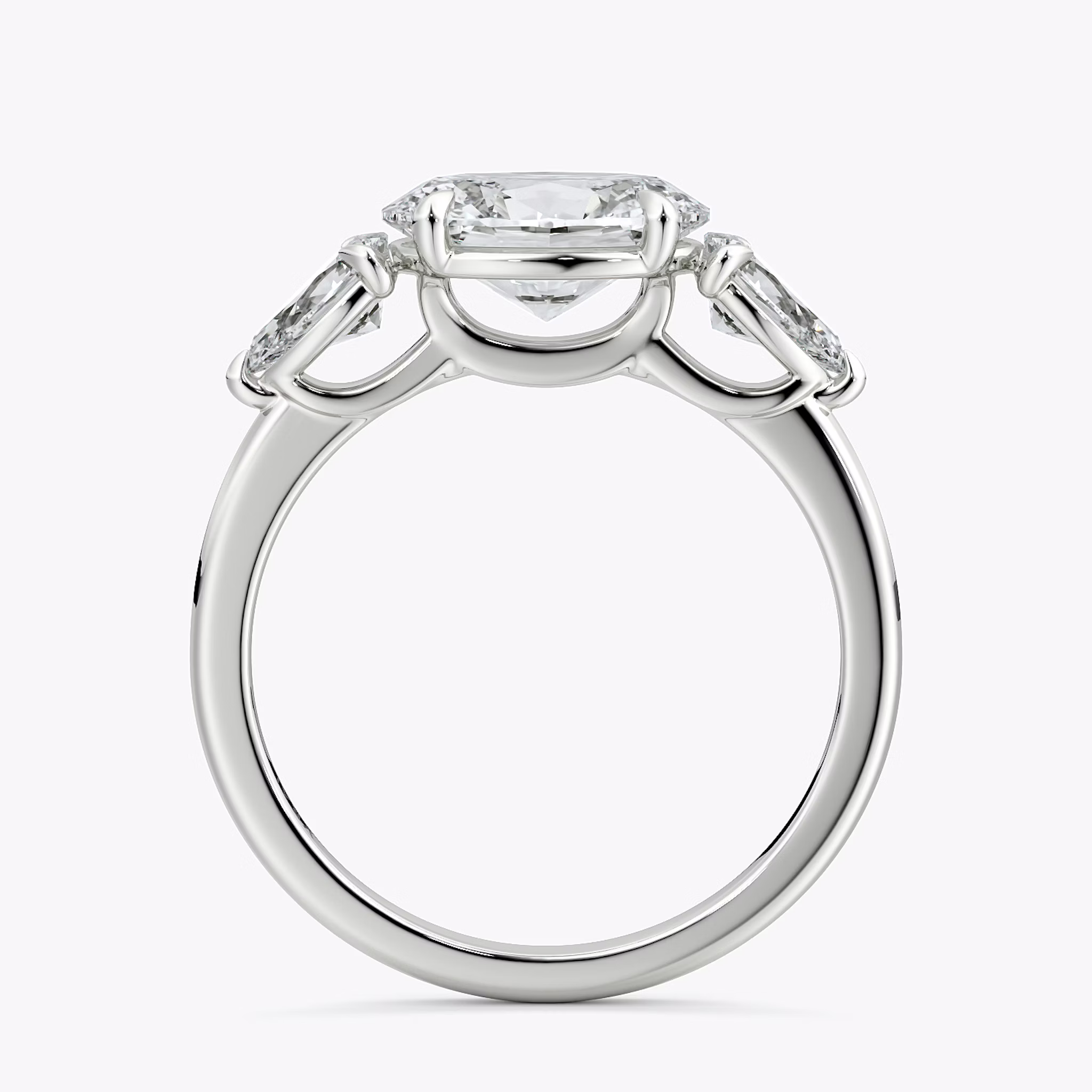 The Three Stone | Oval | 18k | White Gold | bandAccent: Plain | diamondOrientation: horizontal | sideStoneCarat: 0.25ct | sideStoneShape: Pear | caratWeight: other