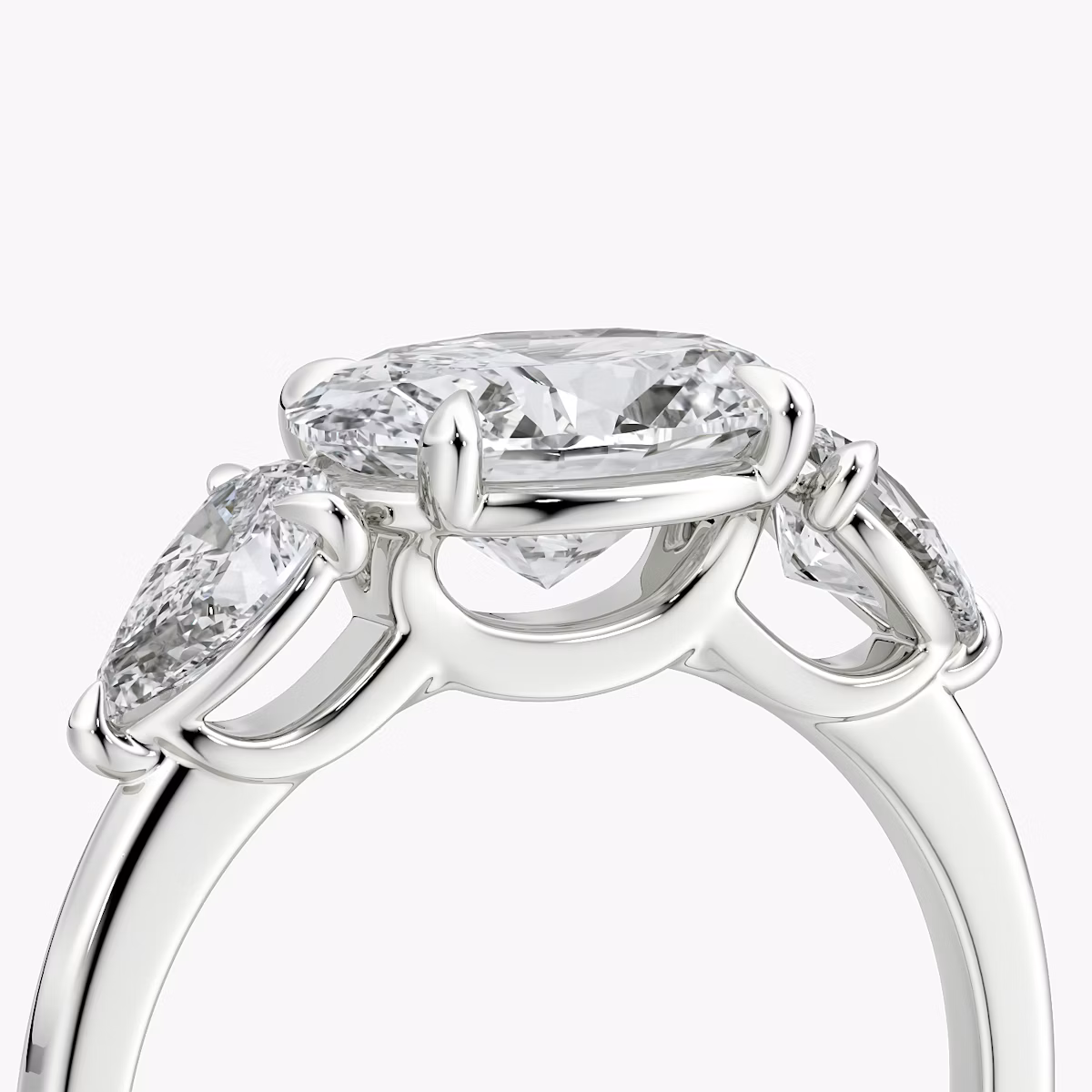 The Three Stone | Oval | Platinum | bandAccent: Plain | diamondOrientation: horizontal | sideStoneCarat: 0.25ct | sideStoneShape: Pear | caratWeight: other