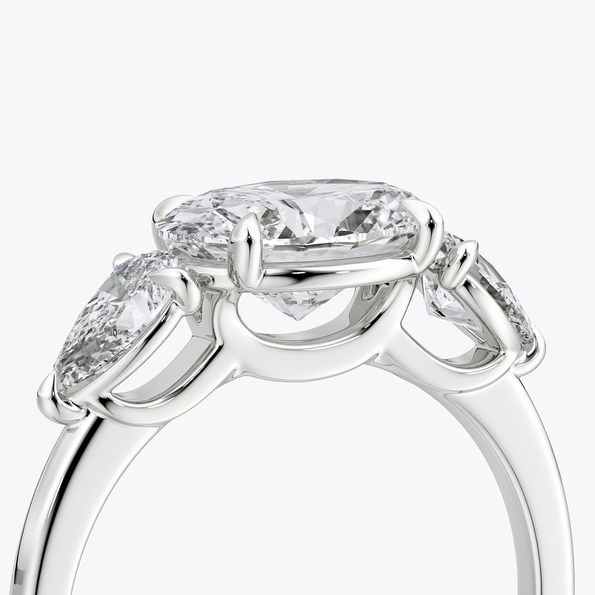 The Three Stone | Oval | 18k | White Gold | bandAccent: Plain | diamondOrientation: horizontal | sideStoneCarat: 0.25ct | sideStoneShape: Pear | caratWeight: other