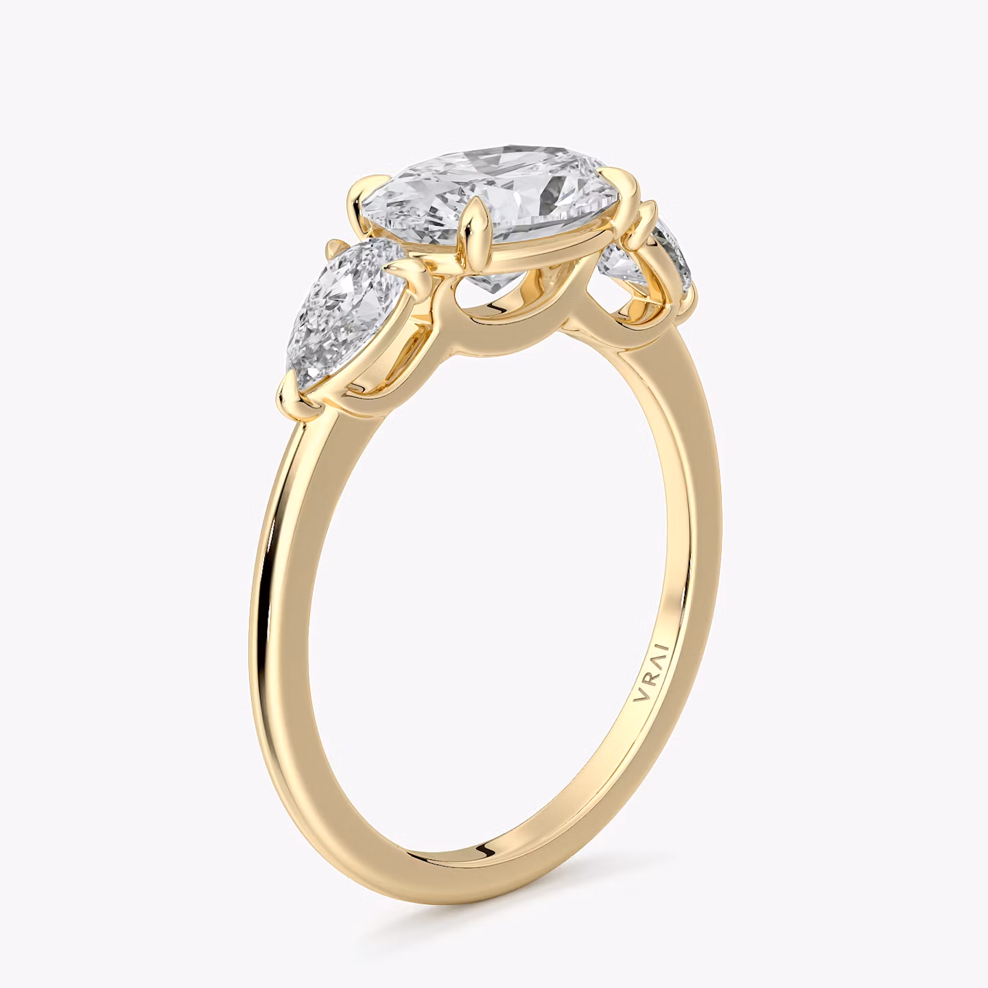 The Three Stone | Oval | 18k | Yellow Gold | bandAccent: Plain | diamondOrientation: horizontal | sideStoneCarat: 0.25ct | sideStoneShape: Pear | caratWeight: other