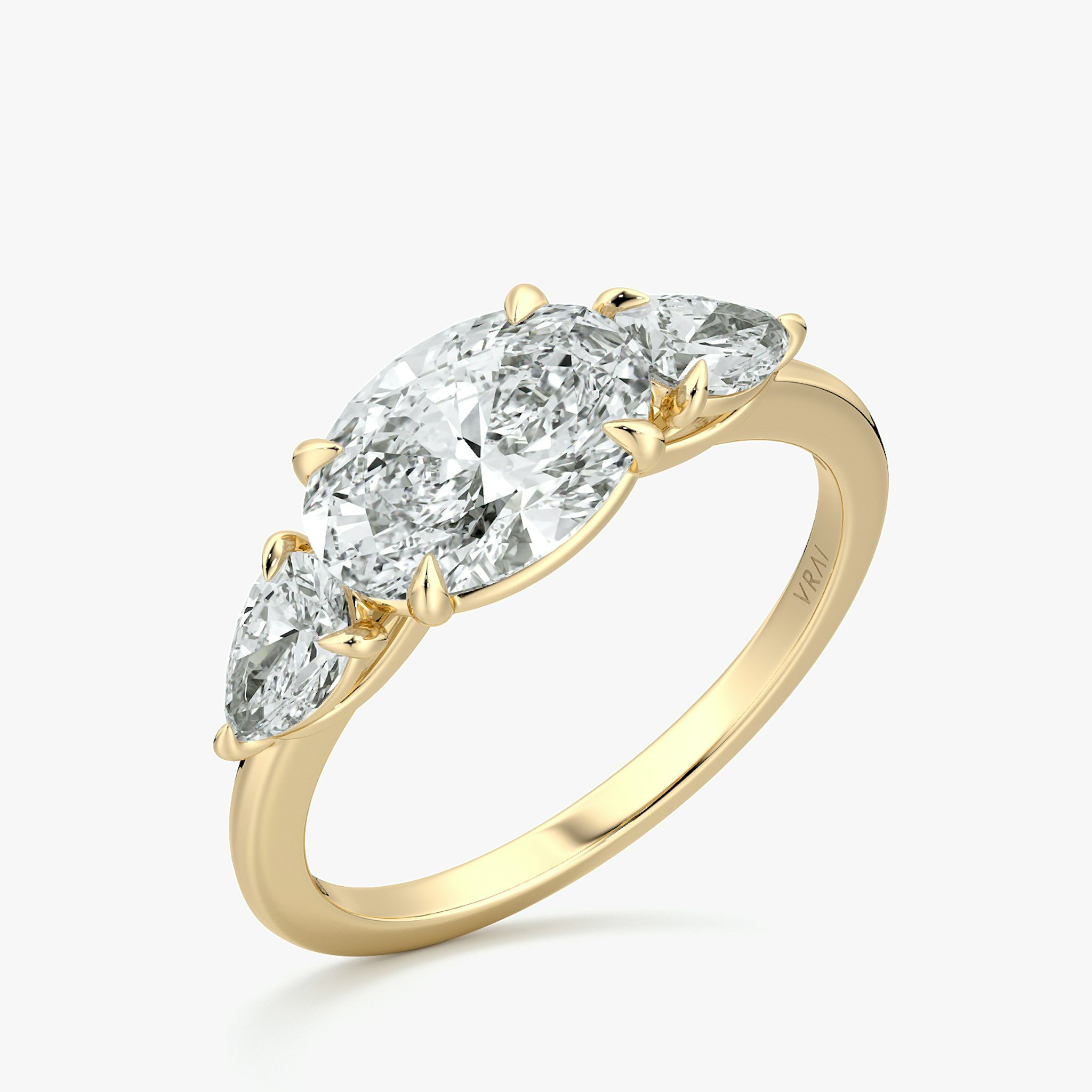 The Three Stone | Oval | 18k | Yellow Gold | bandAccent: Plain | diamondOrientation: horizontal | sideStoneCarat: 0.25ct | sideStoneShape: Pear | caratWeight: other